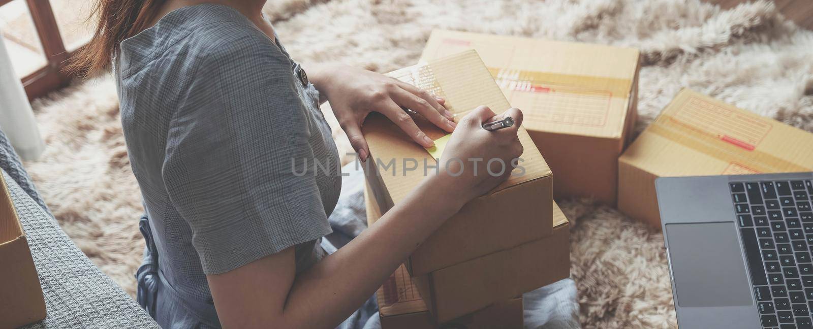 Small Entrepreneurs Start A Home Business By Arranging Goods With Brown Parcel Boxes, Small Home Business Startup Ideas..