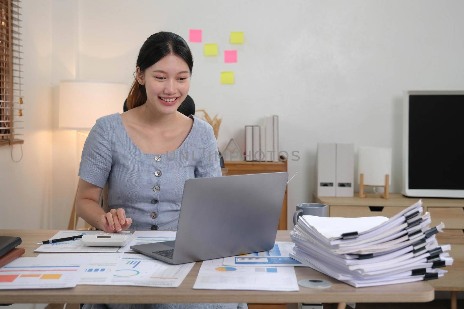 Portrait of Young woman using laptop computer at the office, Student girl working at home. Work or study from home, Asian woman freelance, business, lifestyle concept.