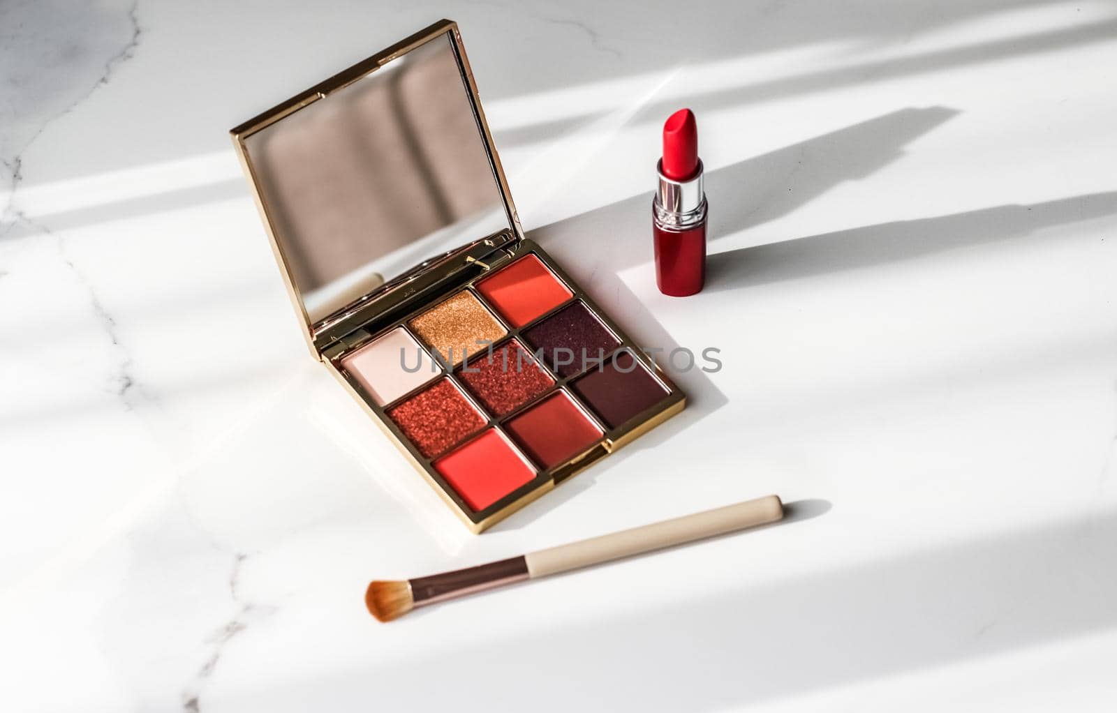 Cosmetic branding, girly and glamour concept - Cosmetics, makeup products set on marble vanity table, lipstick, eyeshadows and make-up brush for luxury beauty and fashion brand ads, holiday design