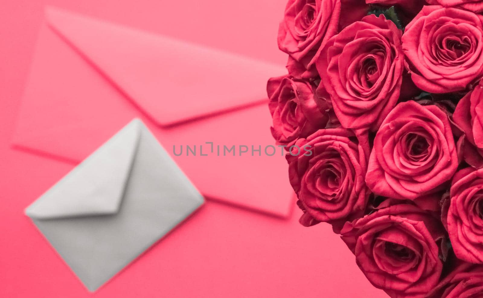 Holidays gift, floral present and happy relationship concept - Love letter and flowers delivery on Valentines Day, luxury bouquet of roses and card on pink background for romantic holiday design