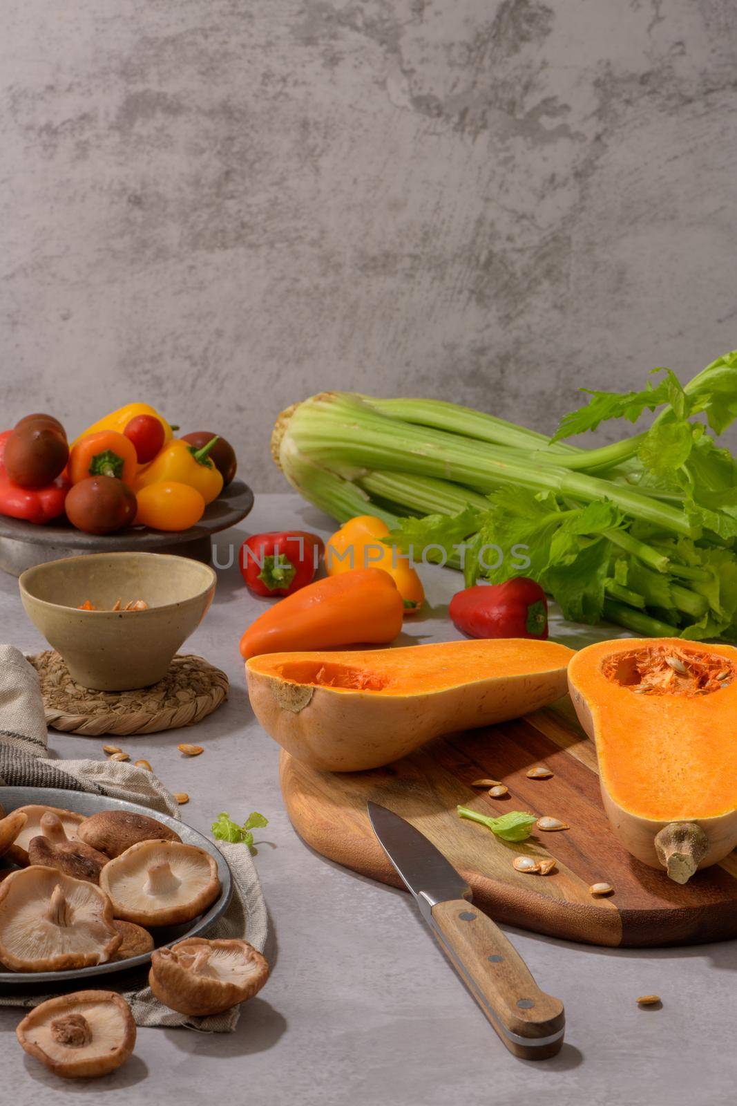 Autumn vegetables arranged on a kitchen worktop by homydesign