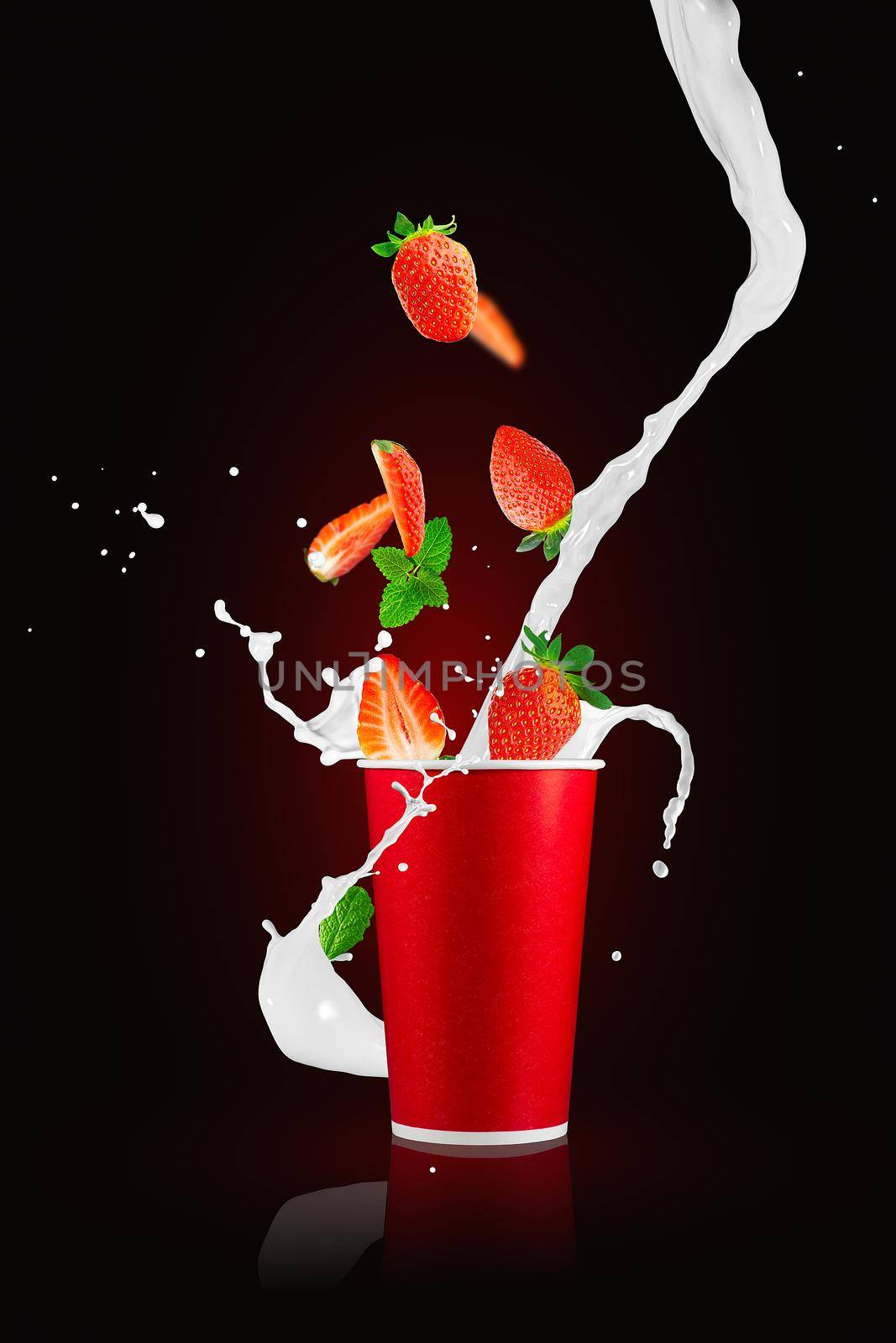 Strawberry berries falling in paper takeaway cup with milk splashes. Strawberry smoothie splash. by PhotoTime