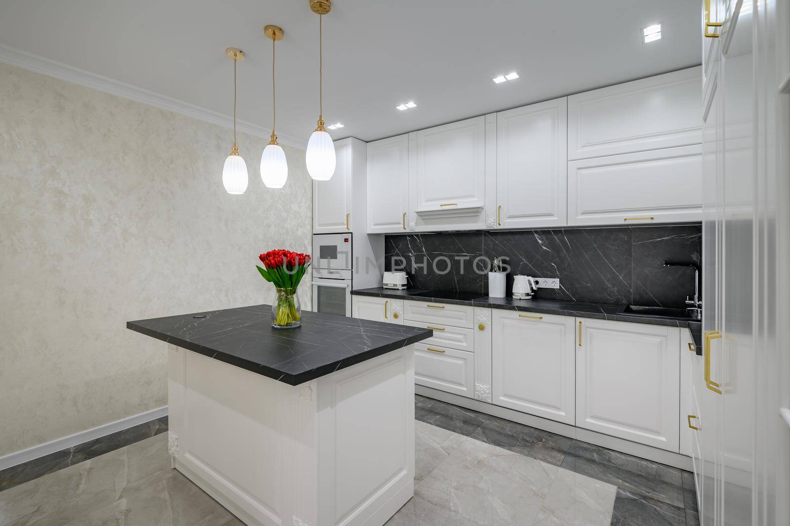 Luxury large modern domestic kitchen furniture with island and black marble worktop