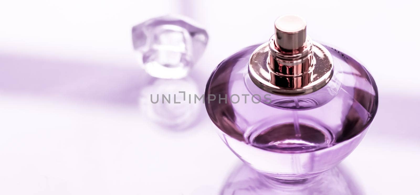 Purple perfume bottle on glossy background, sweet floral scent, glamour fragrance and eau de parfum as holiday gift and luxury beauty cosmetics brand design by Anneleven