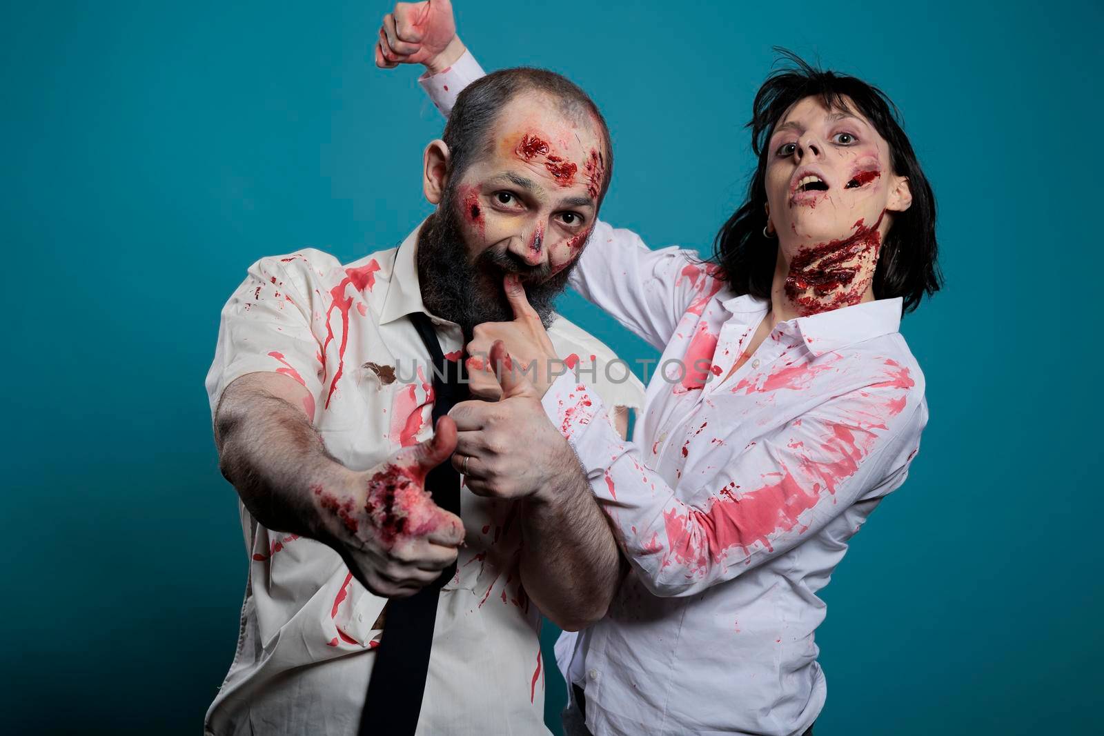 Couple of zombies doing thumbs up sign by DCStudio