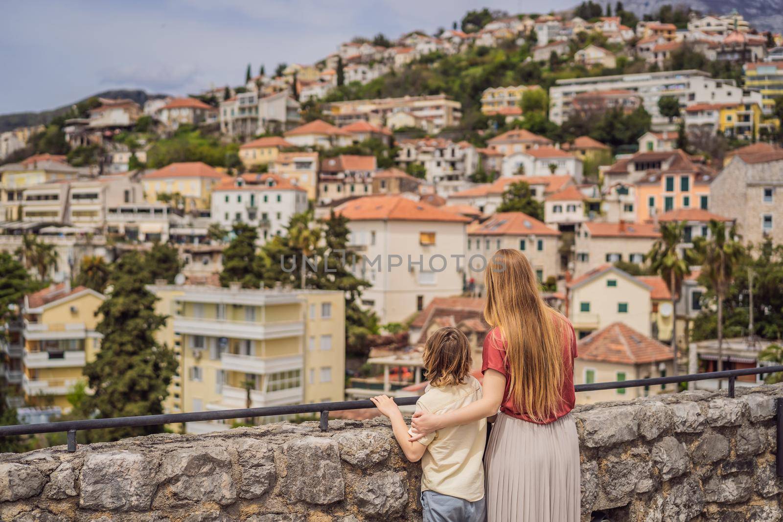 Mom and son tourists in Herceg Novi old town. Historical and touristic center of Herceg Novi. Montenegro.