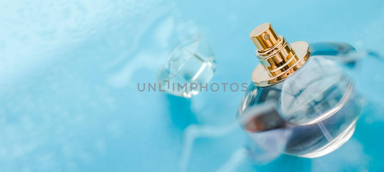Perfumery, cosmetics and branding concept - Perfume bottle under blue water, fresh sea coastal scent as glamour fragrance and eau de parfum product as holiday gift, luxury beauty spa brand present