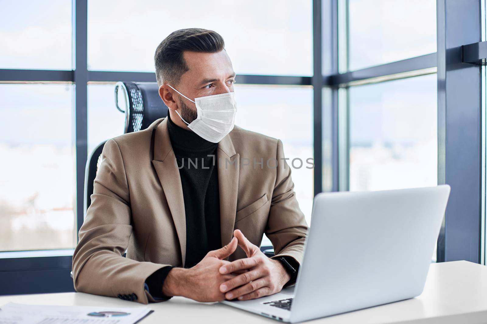 thoughtful business man sitting at his desk. close-up.