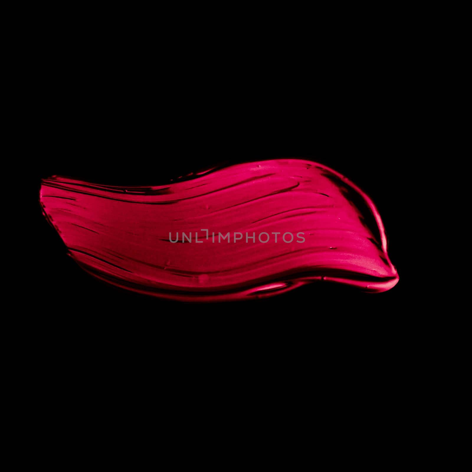 Art abstract, cosmetic product and hand painted design concept - Pink lipstick brush stroke texture isolated on black background