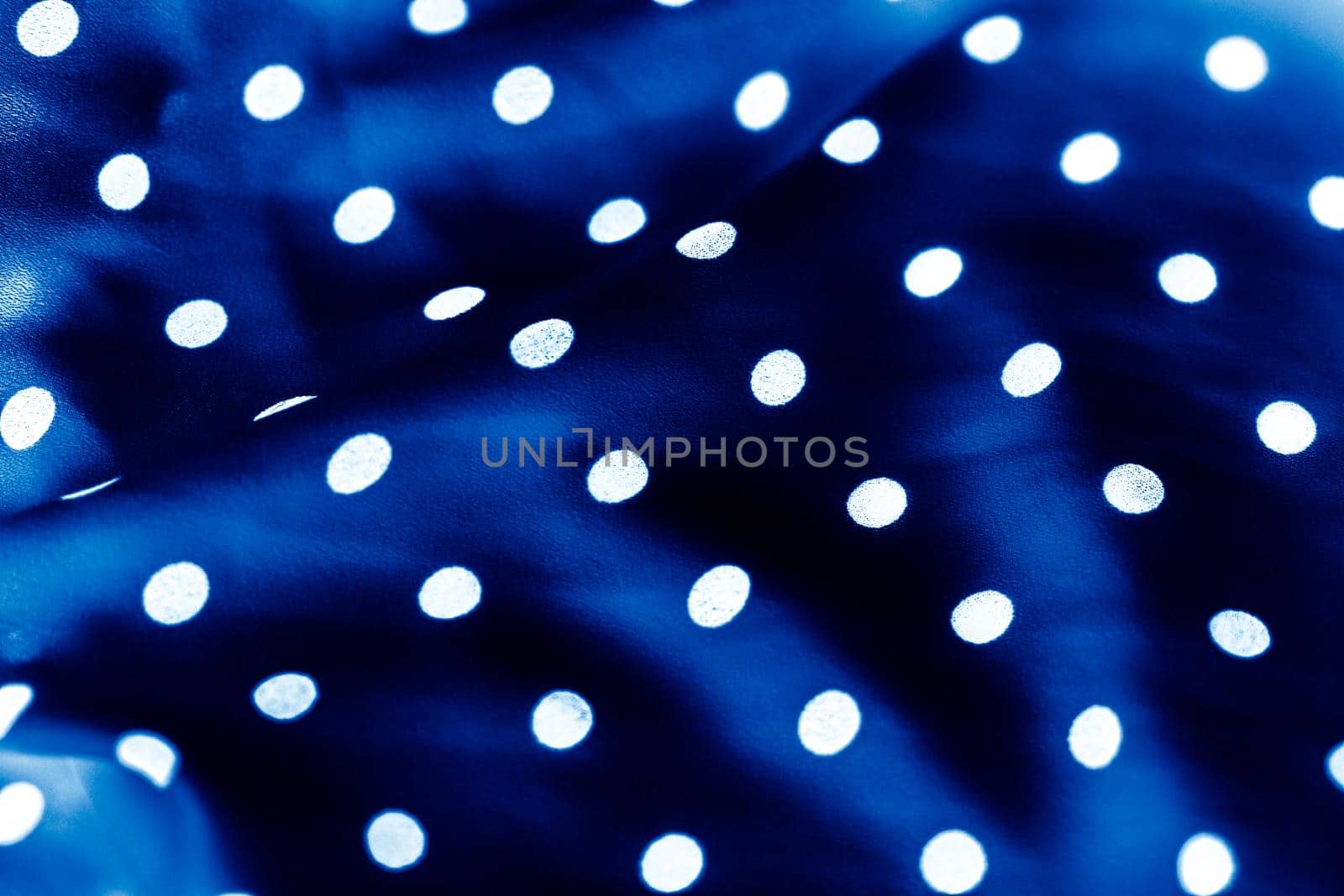 Classic polka dot textile background texture, white dots on blue luxury fabric design pattern by Anneleven
