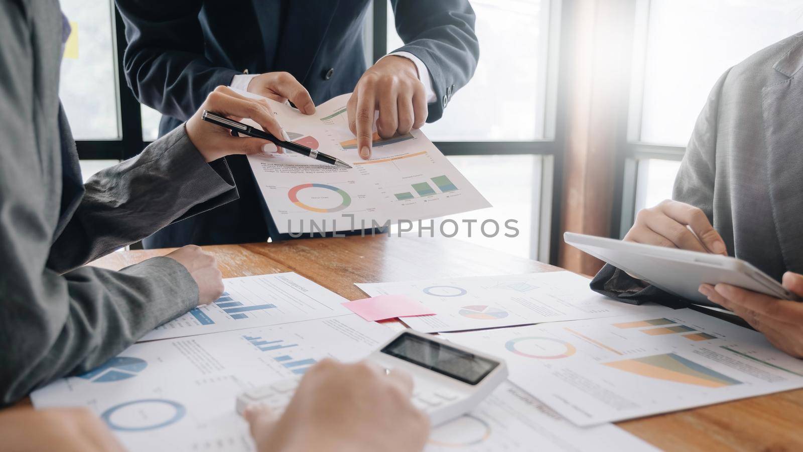 Team of business people working together in the meeting room office, teamwork background charts and graphs banner, double exposure successful teamwork,business planning concept..