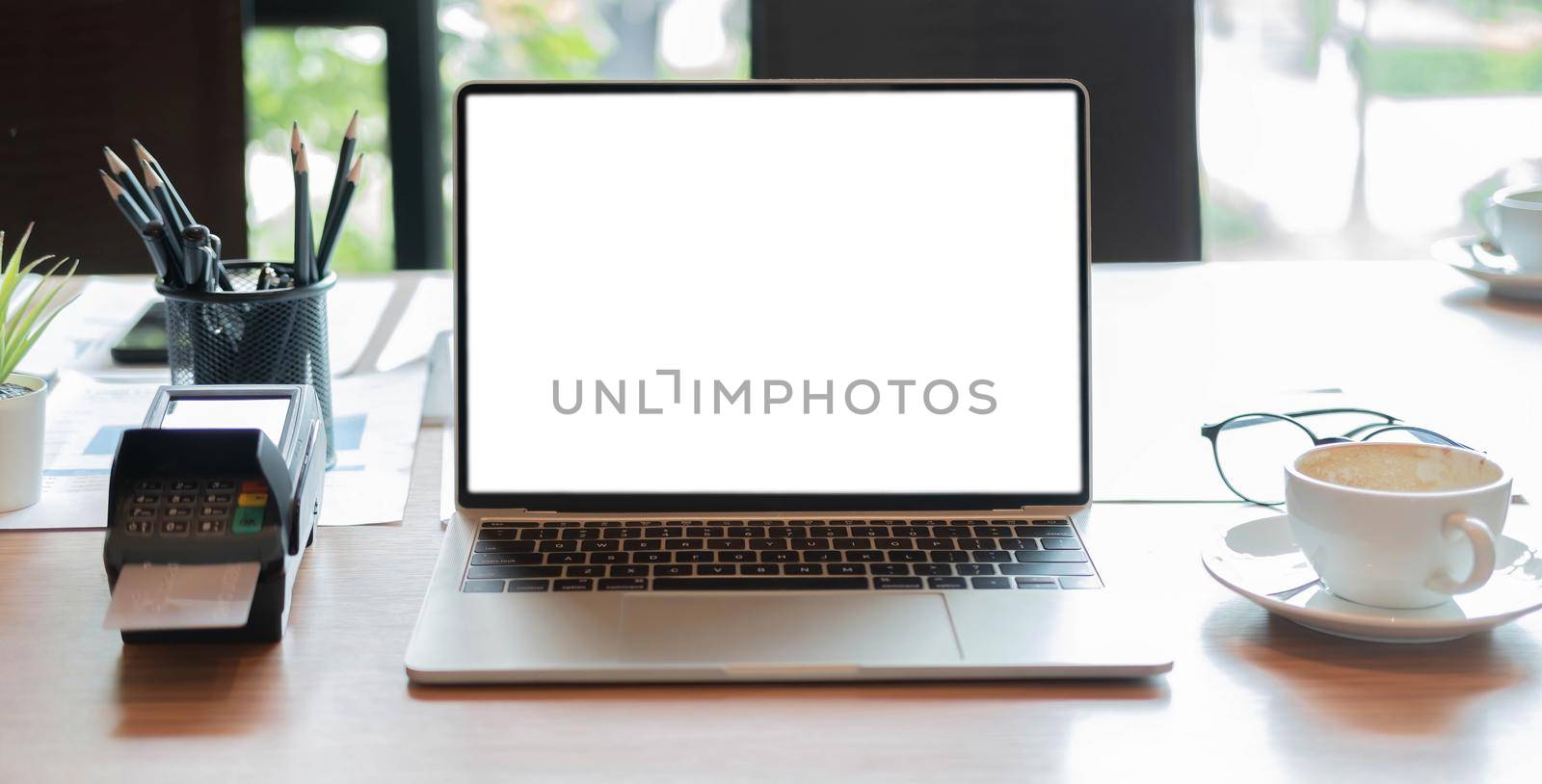 Tablet blank white screen of placed on office table. Mock up. by wichayada