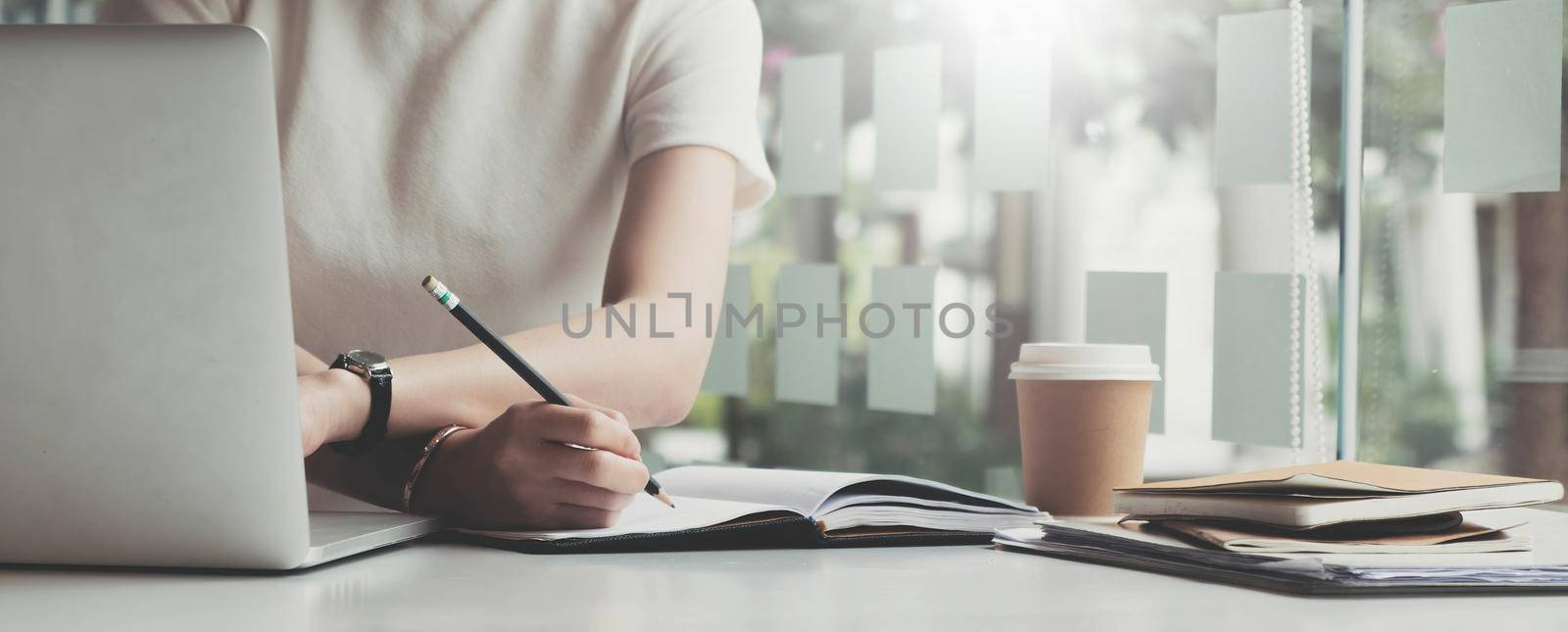 Picture of woman hand filling in invoice paper,Online Taxes And Invoice Billing Electronic Management..