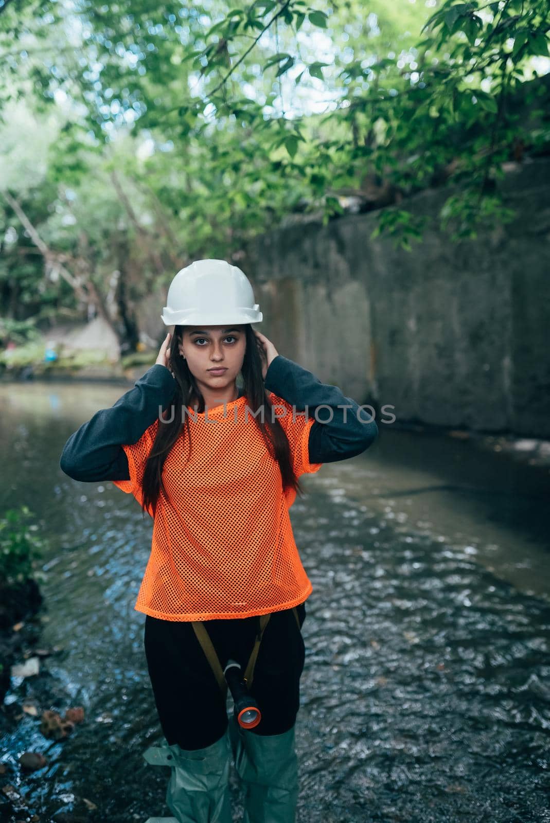 A young female digger walks along a rain collector
