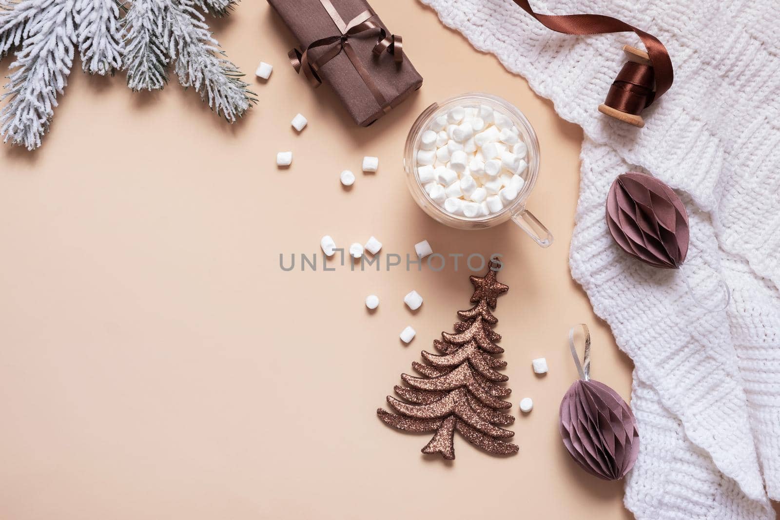 Christmas cozy flat lay composition with gifts, paper balls, Christmas tree and marsh mellow top view. Copy space by ssvimaliss
