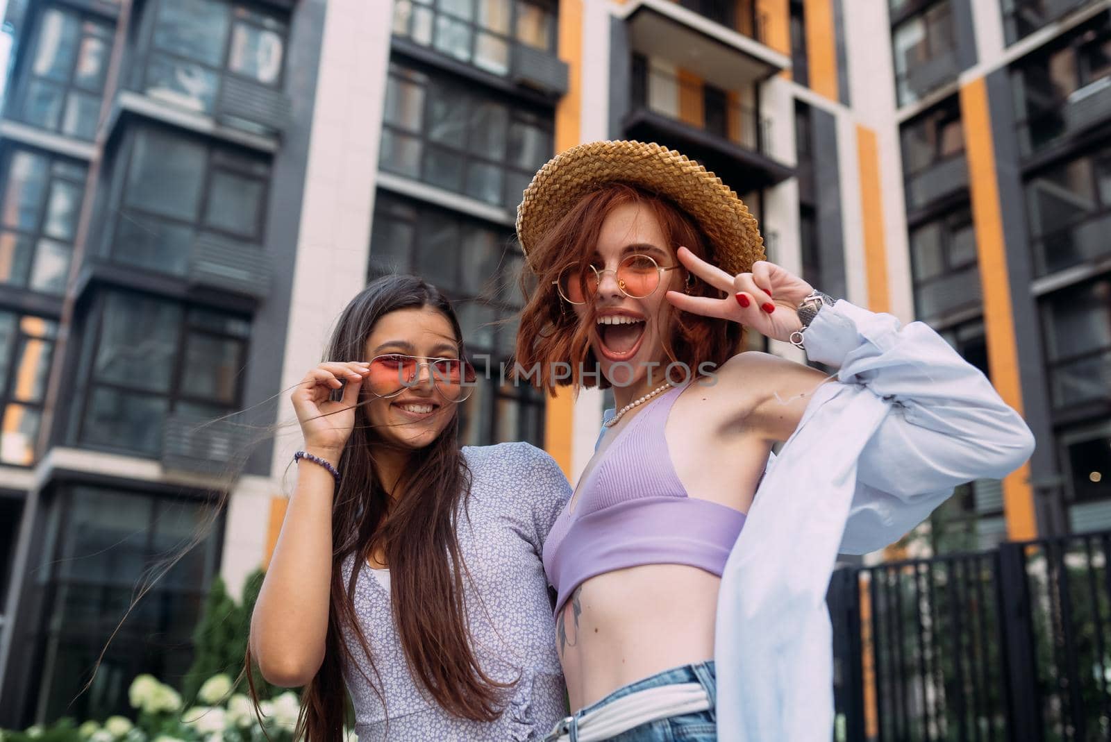 Two lovely girl friends hugging and having fun.