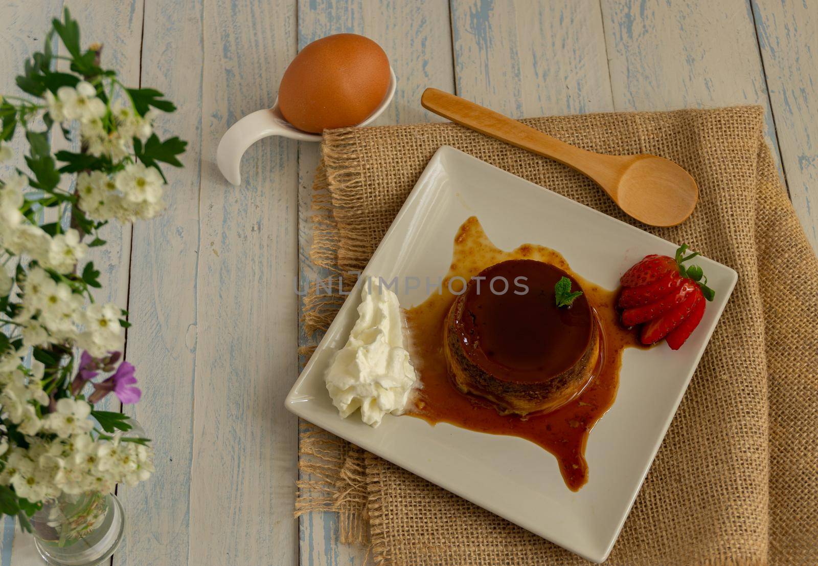 egg custard with cream and strawberries delicatessen