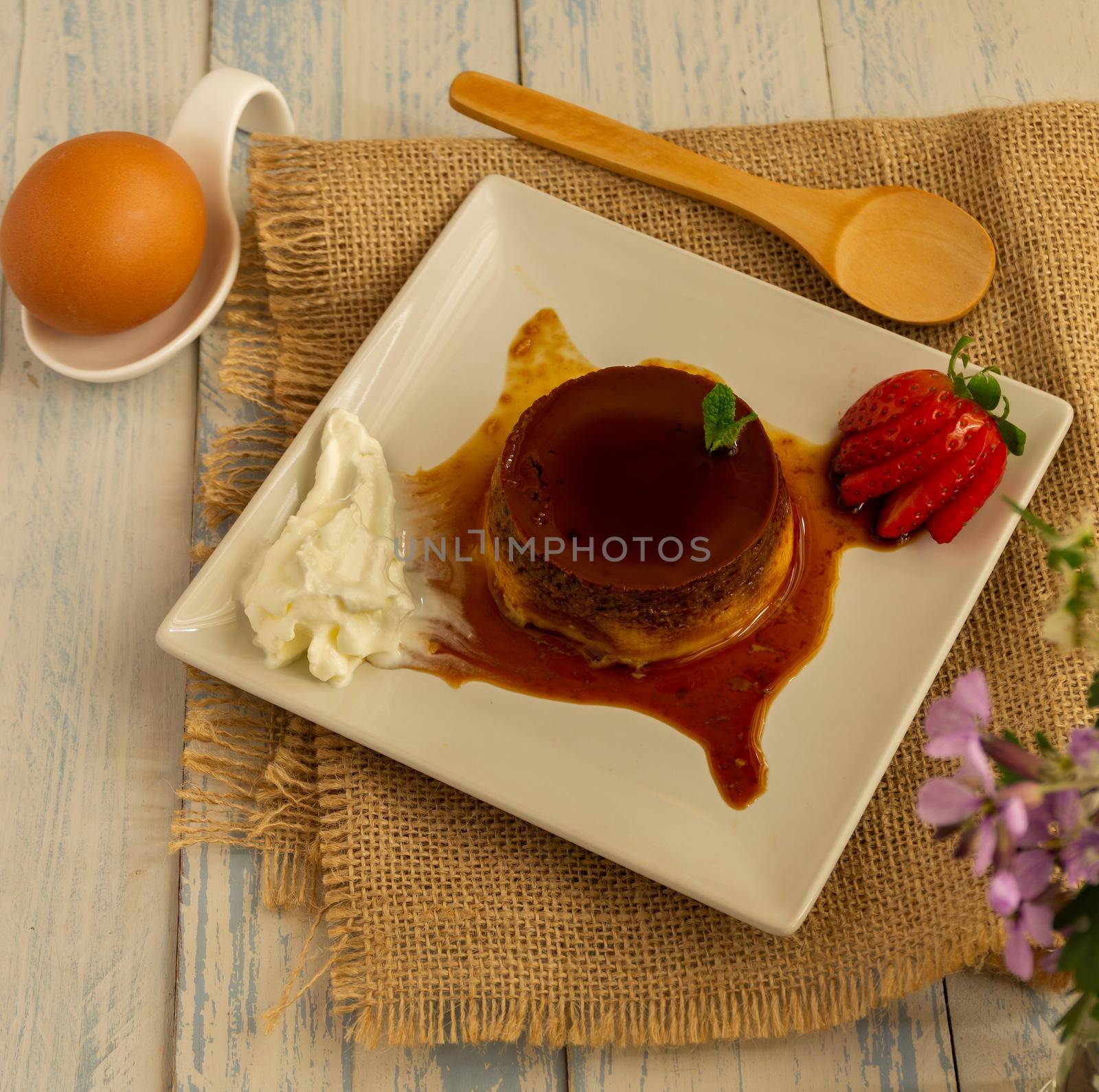 egg custard with cream and strawberries delicatessen