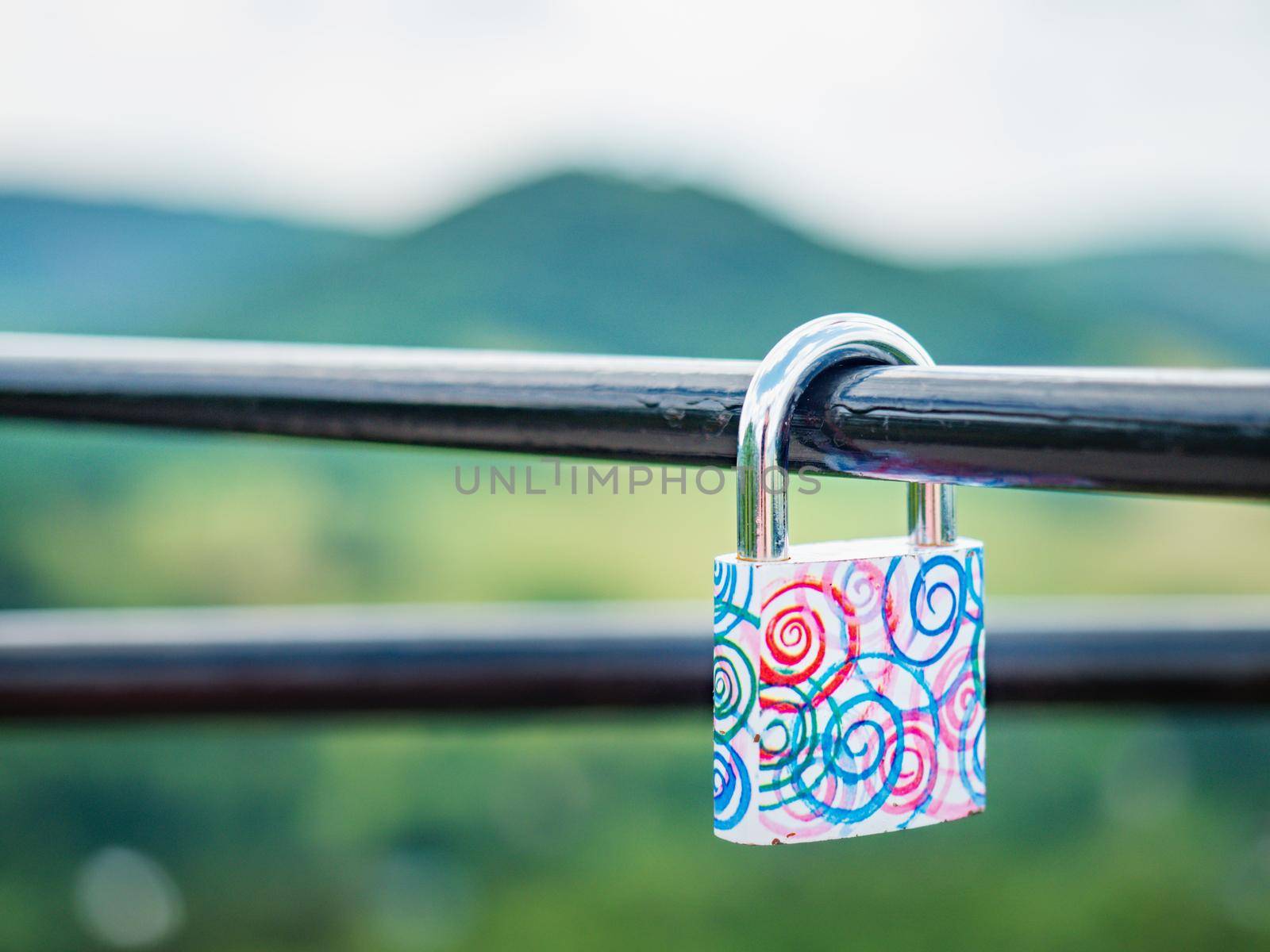 Locked red heart shaped padlock. Symbol of eternal love. Selective focus by rdonar2