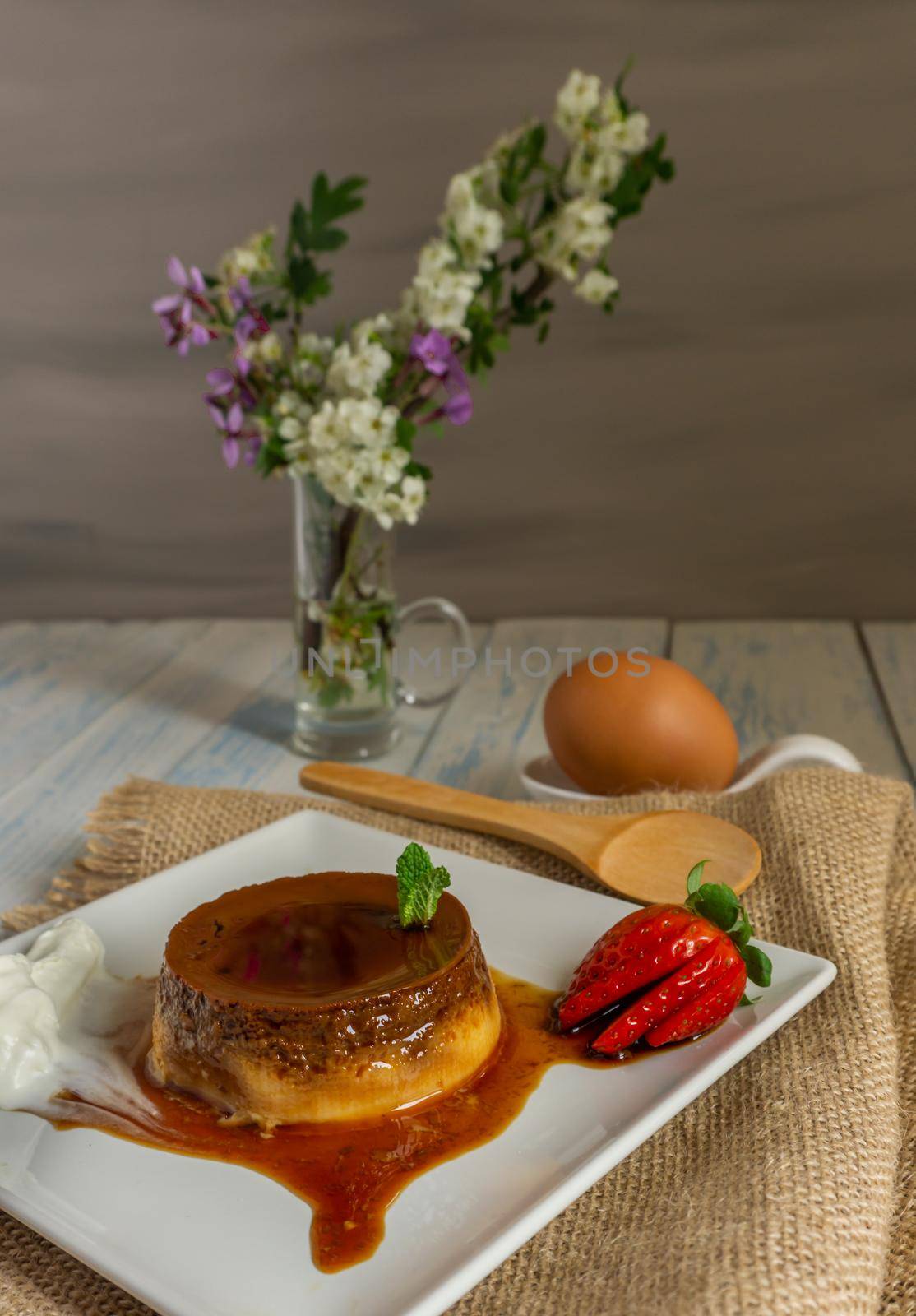 egg custard with cream and strawberries delicatessen