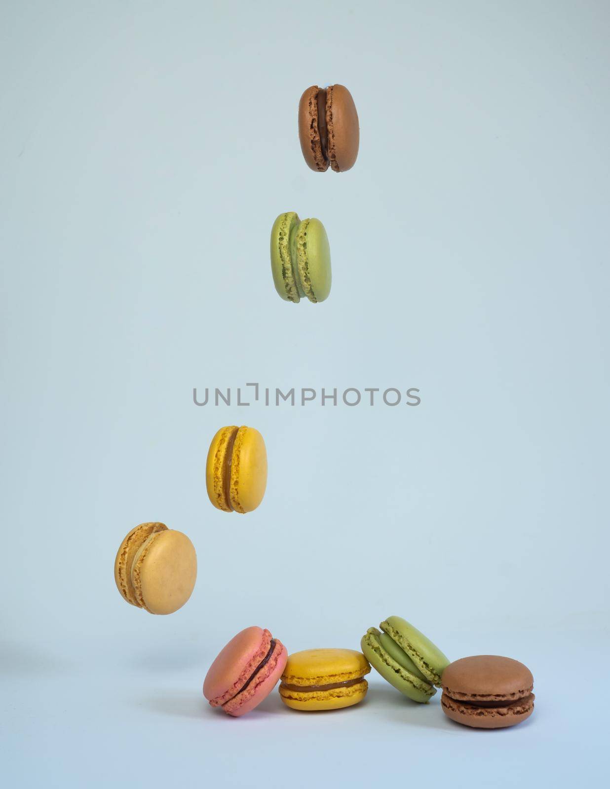 colorful macarons on white background by joseantona