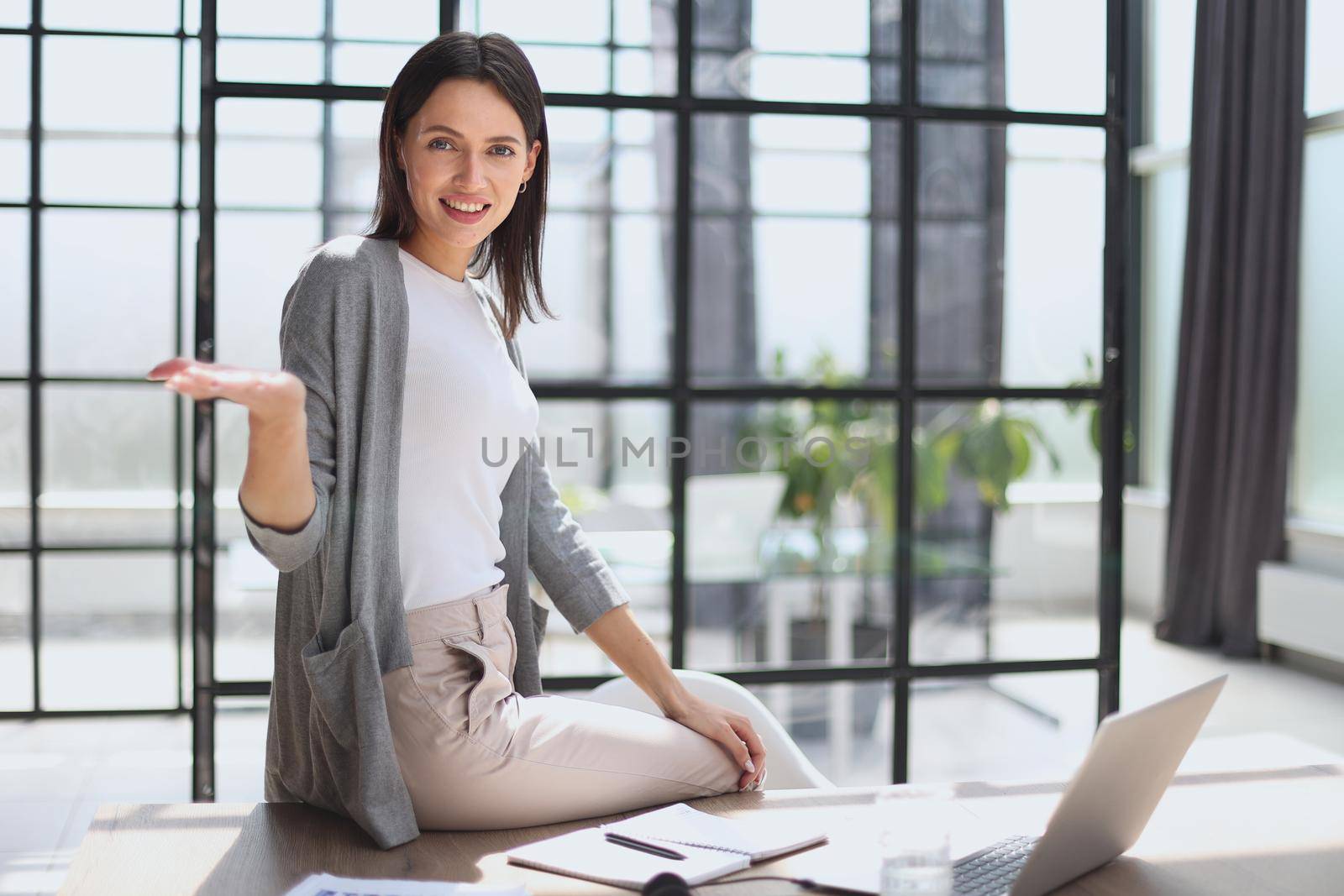 Attractive young businesswoman with a happy smile by Prosto