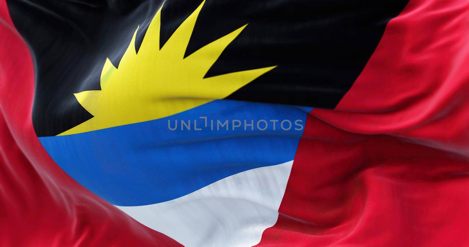 Close-up view of the Antigua and Barbuda national flag waving in the wind by rarrarorro