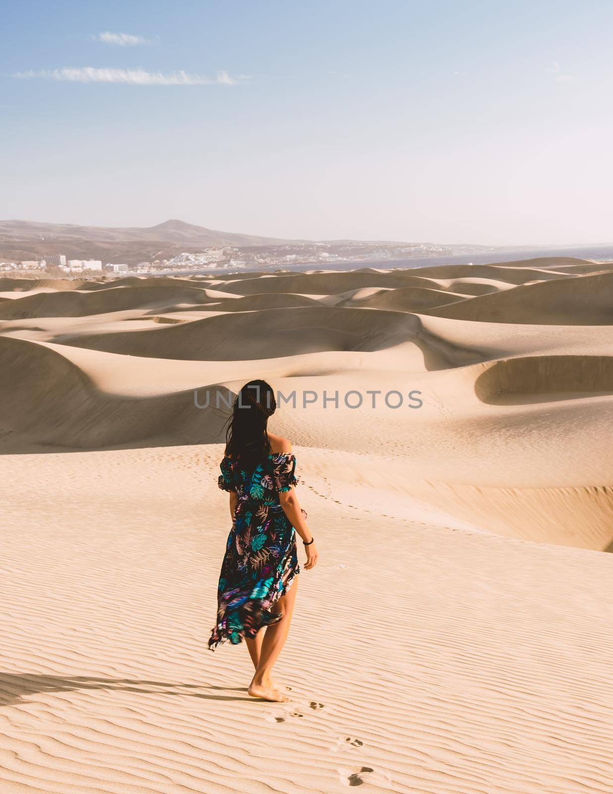 young woman at the dessert of Maspalomas sand dunes Gran Canaria during vacation Canary Islands by fokkebok