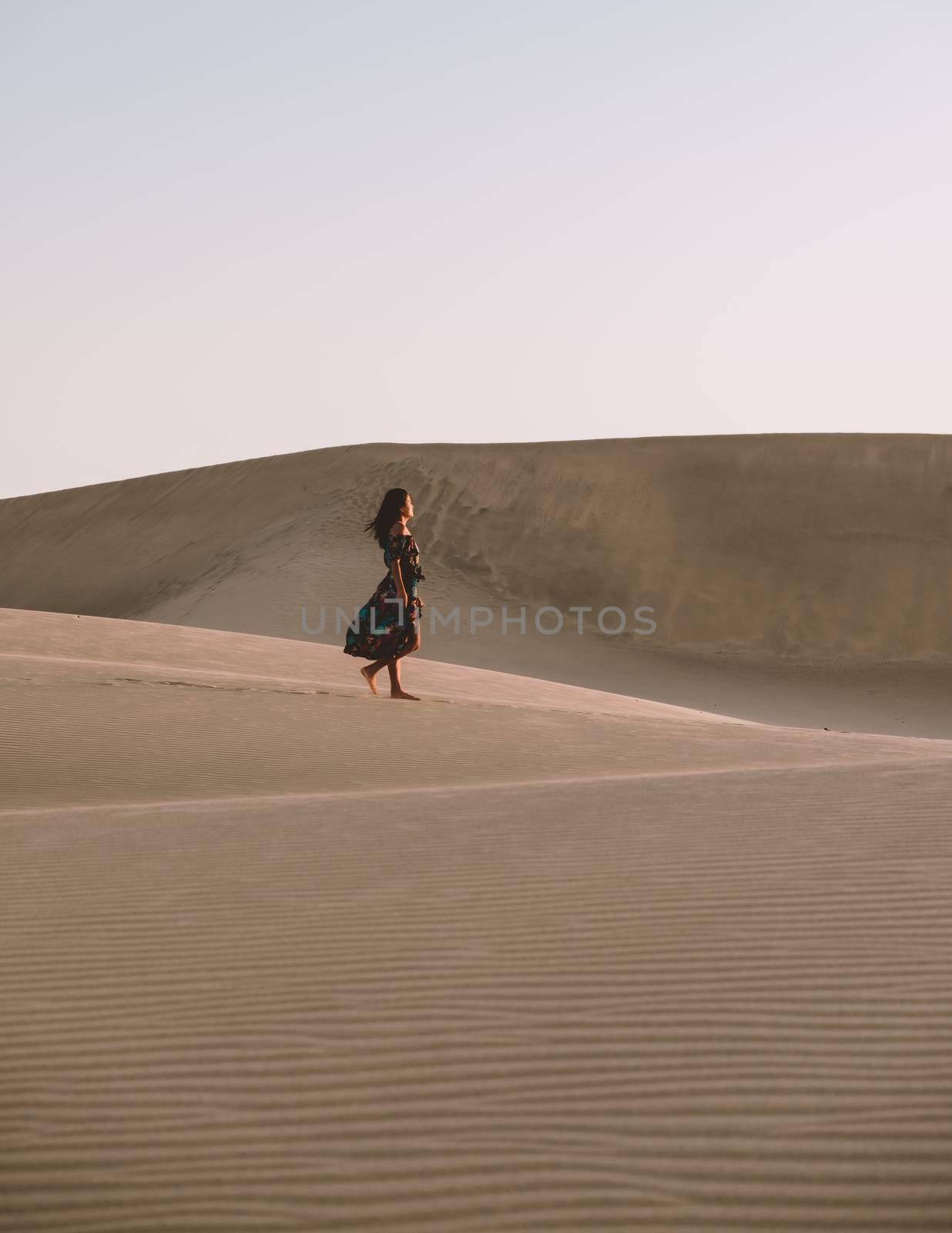 young woman at the dessert of Maspalomas sand dunes Gran Canaria during vacation Canary Islands by fokkebok