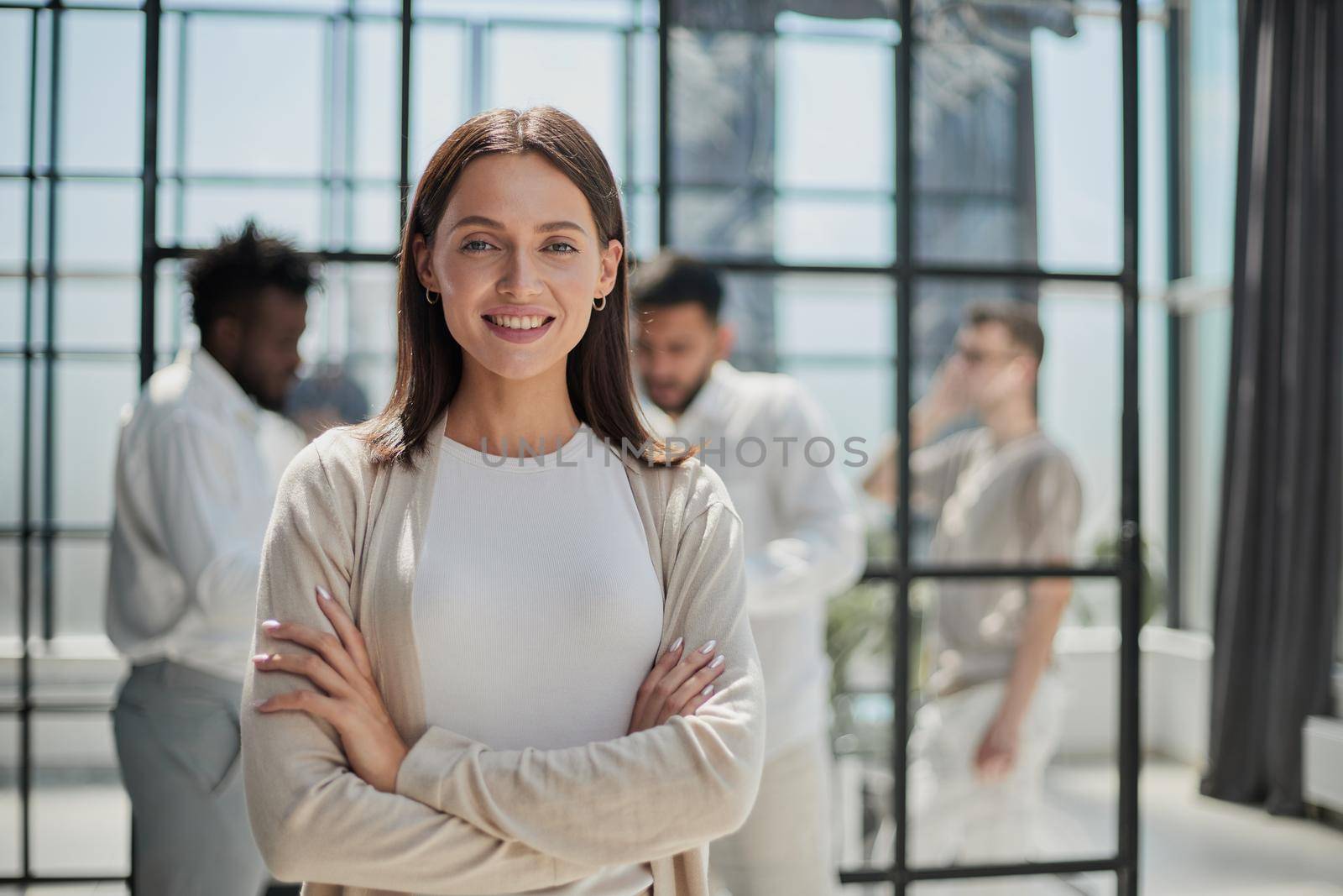 Face of beautiful woman on the background of business people