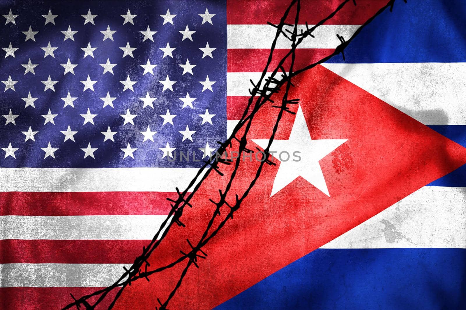 Grunge flags of USA and Cuba divided by barb wire illustration by xbrchx