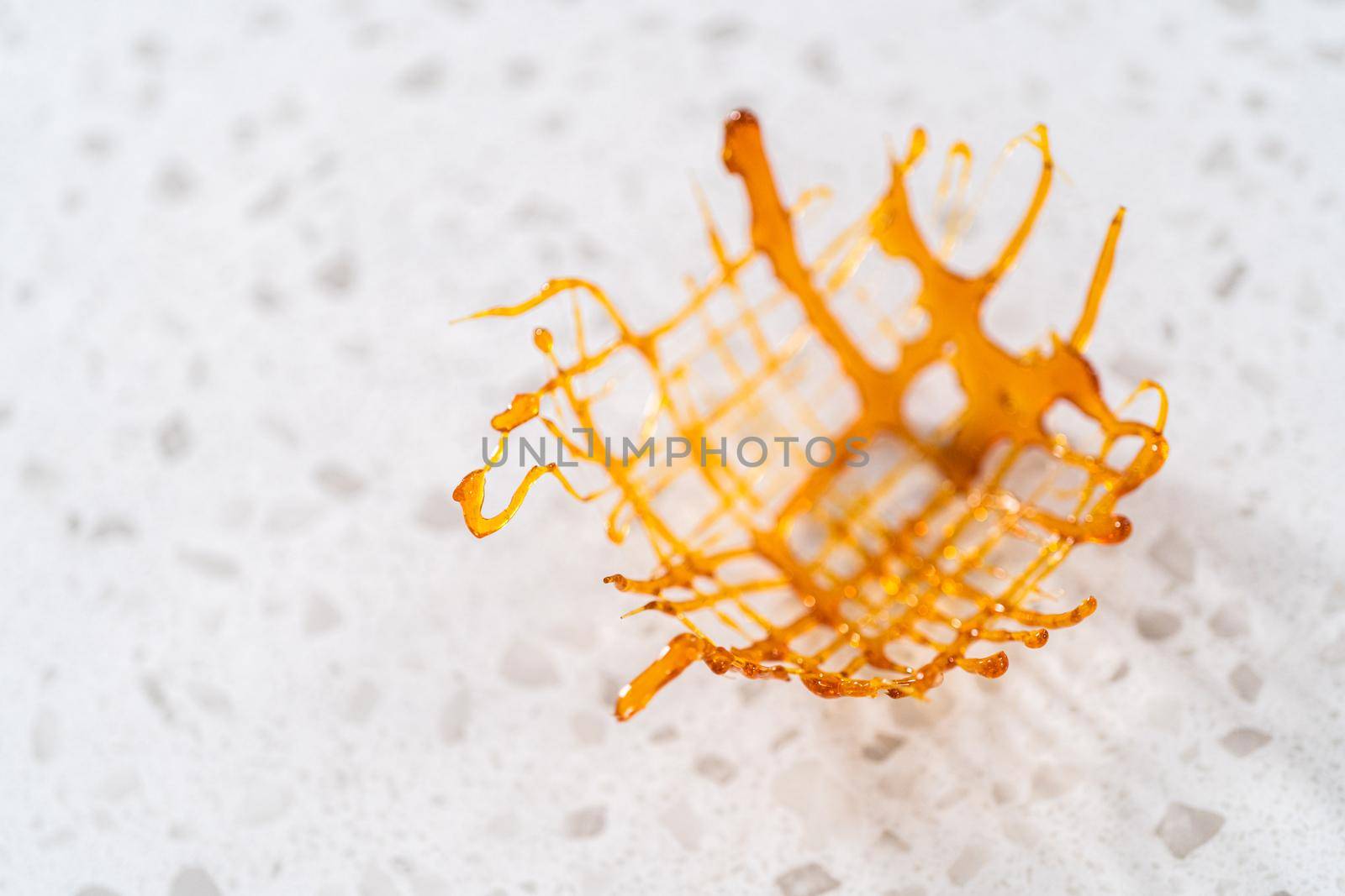 Crunchy caramel cupcake toppers on the counter.