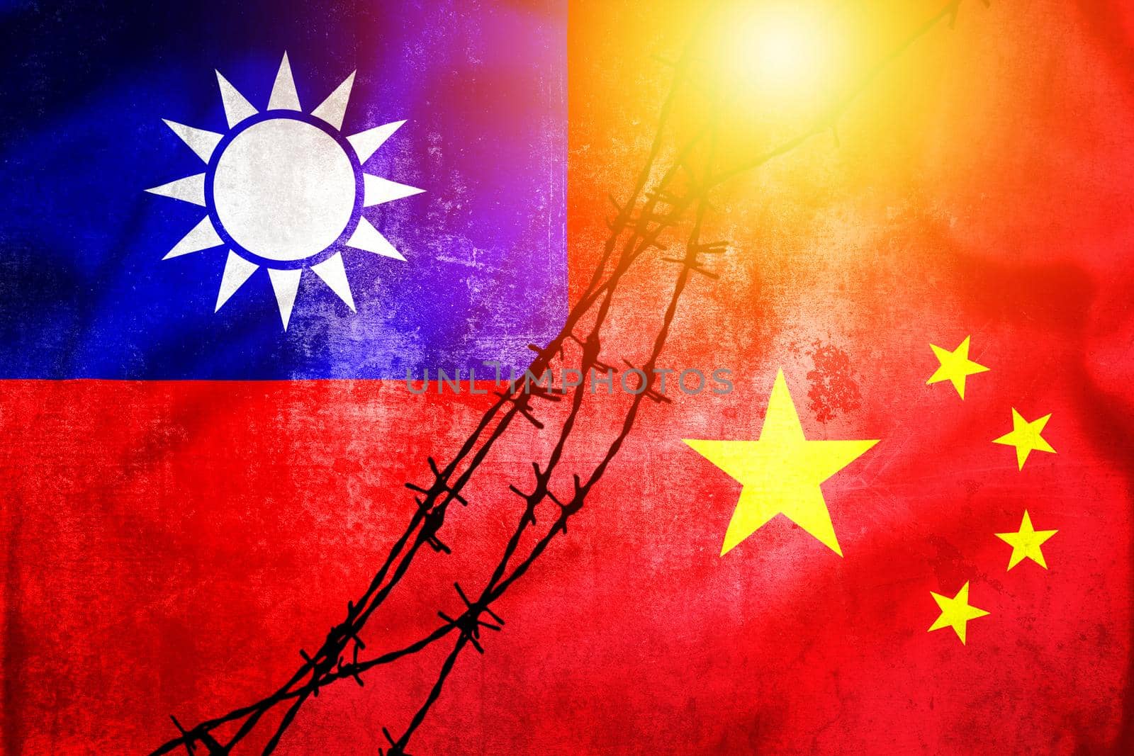 Grunge flags of Taiwan and China divided by barb wire sun haze illustration, concept of tense relations between Taiwan and China 