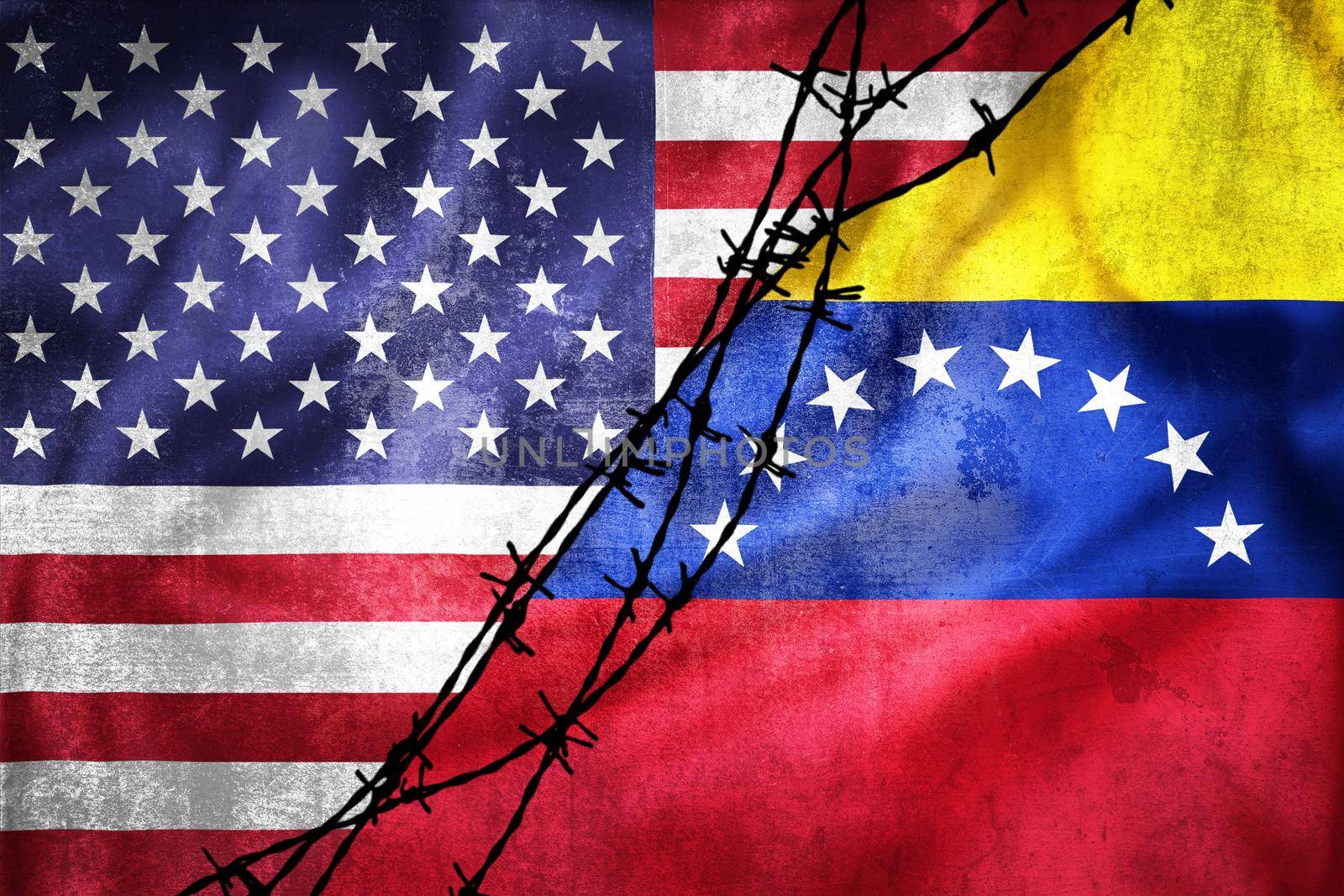 Grunge flags of USA and Venezuela divided by barb wire illustration, concept of tense relations between USA and Venezuela 