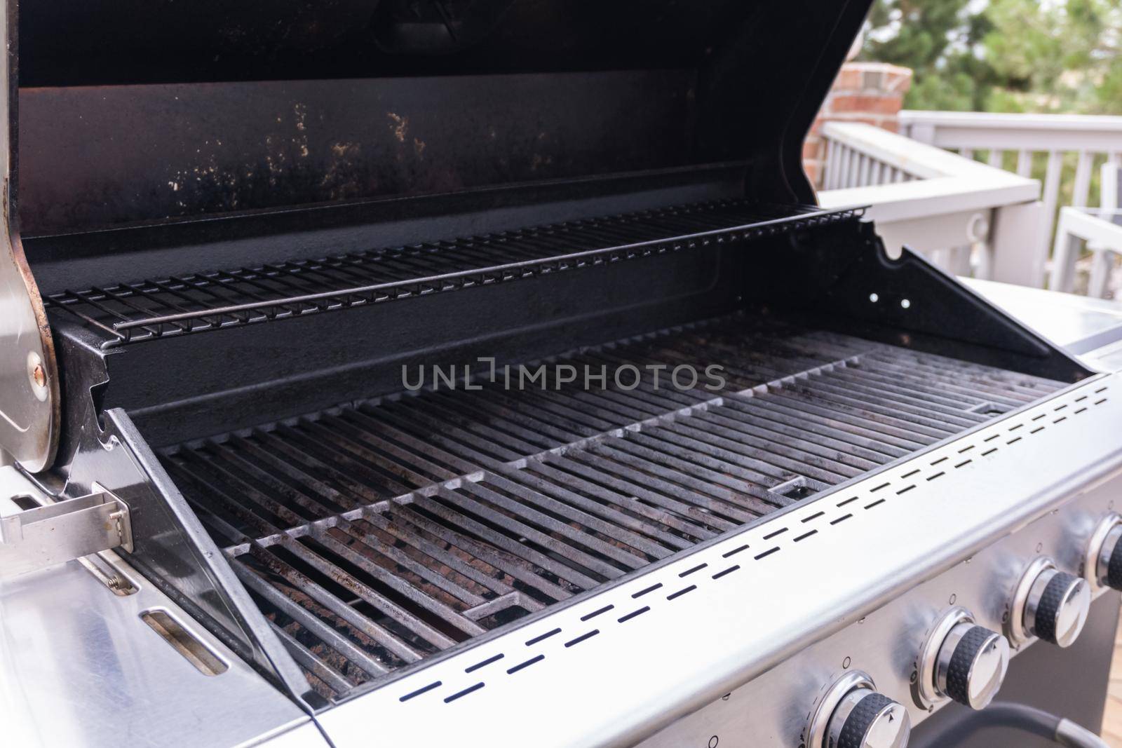 Clean six-burner gas grill ready for summer grilling.