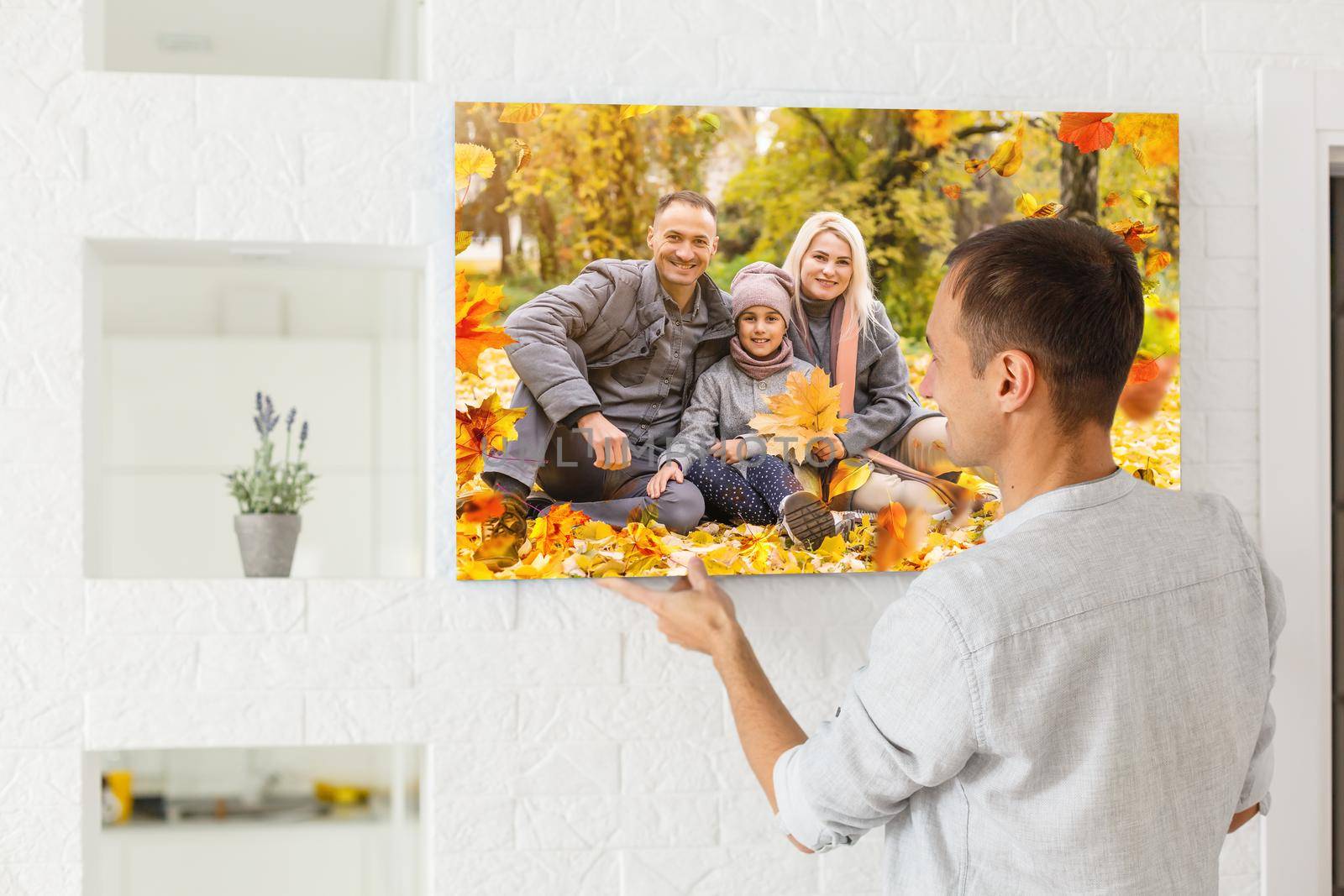 Canvas print with gallery wrap. man hangs autumn photography, photocanvas.