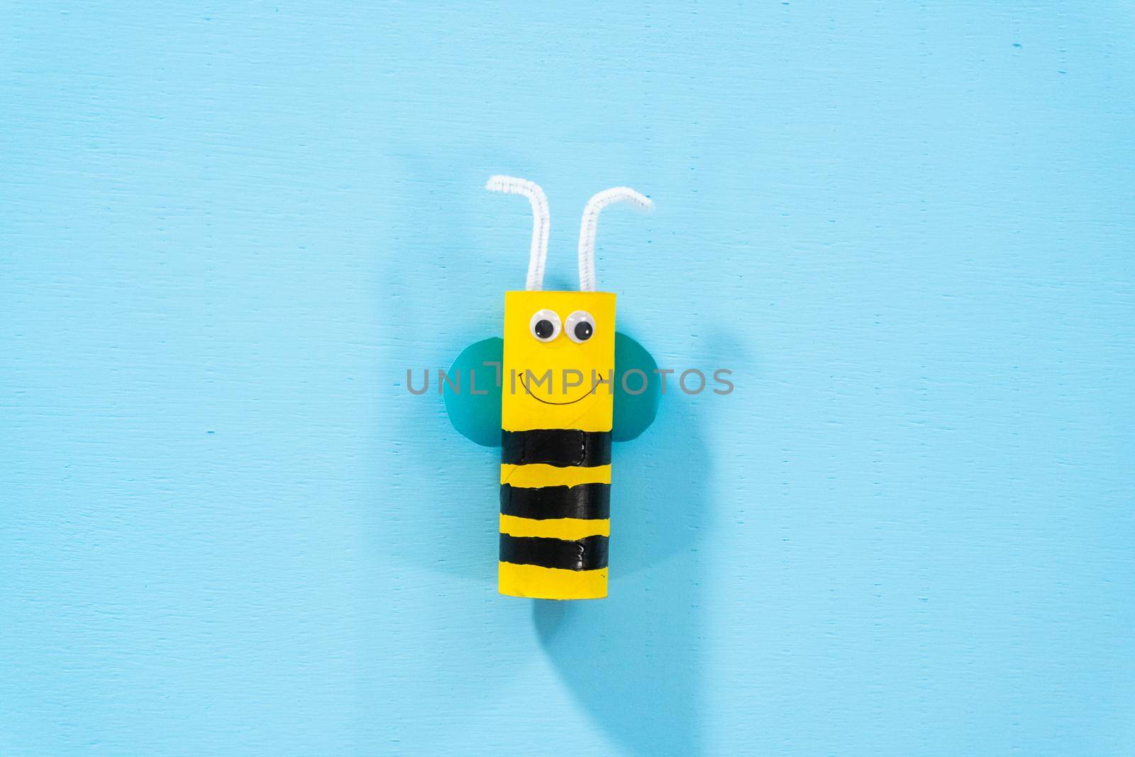 Papercraft project. Colorful bugs made out of empty toilet rolls.