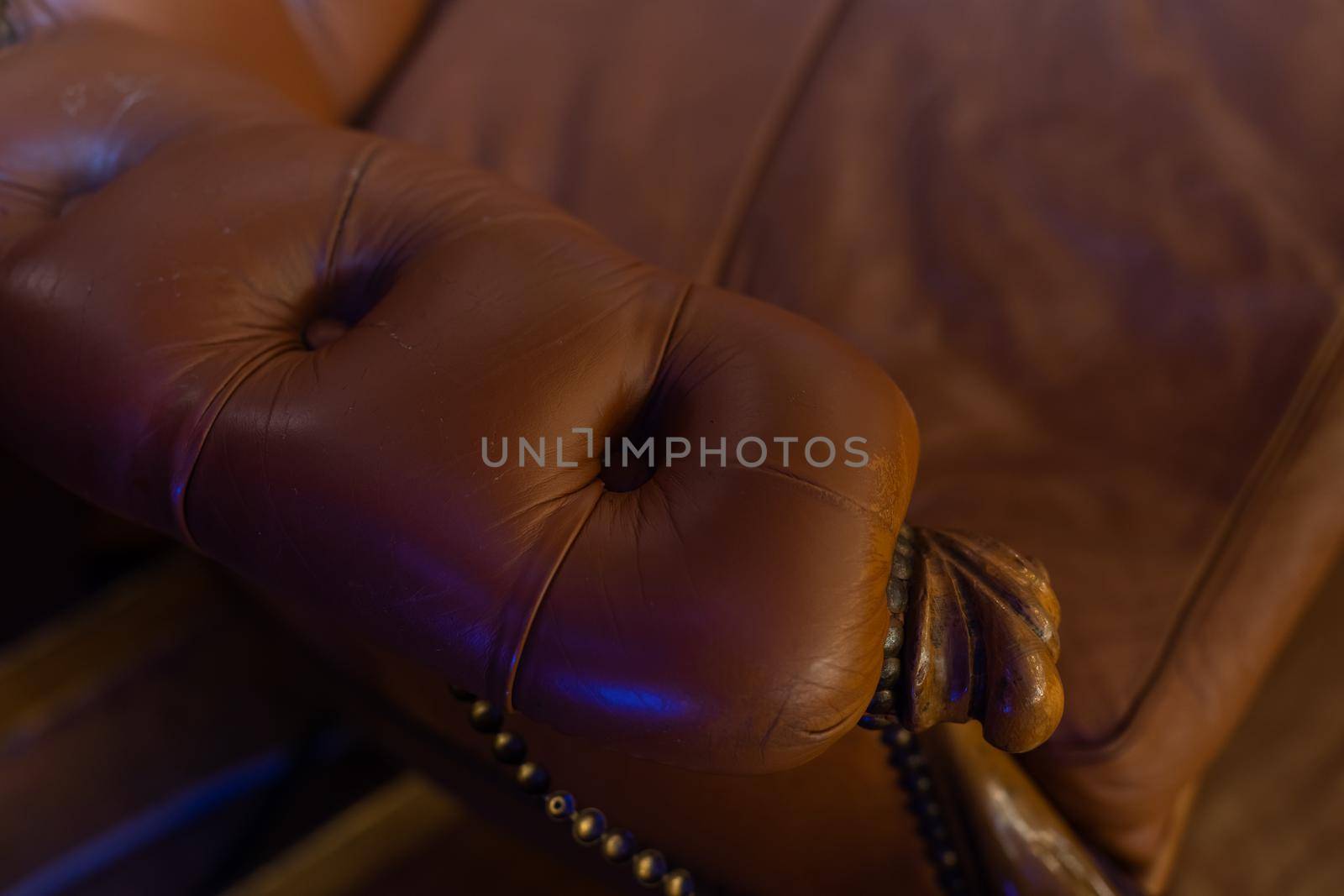 Deep brown leather luxury sofa background.