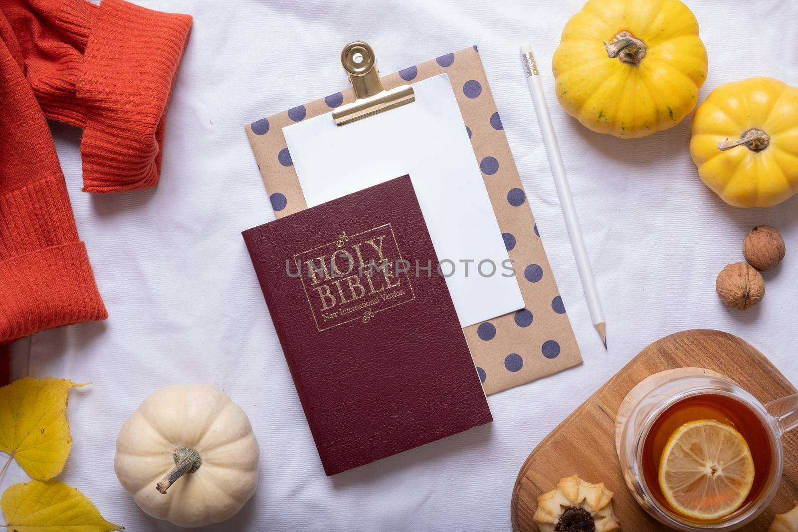 Holy Bible and autumn cozy decor top view. Bible study fall concept.
