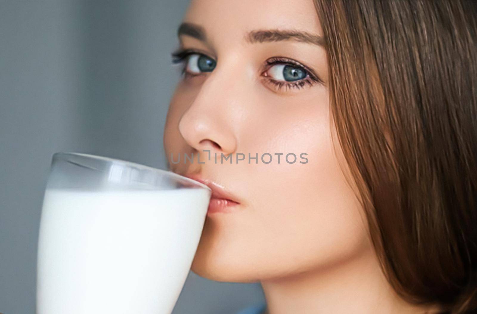 Diet and wellness, young woman drinking milk or protein shake cocktail, portrait