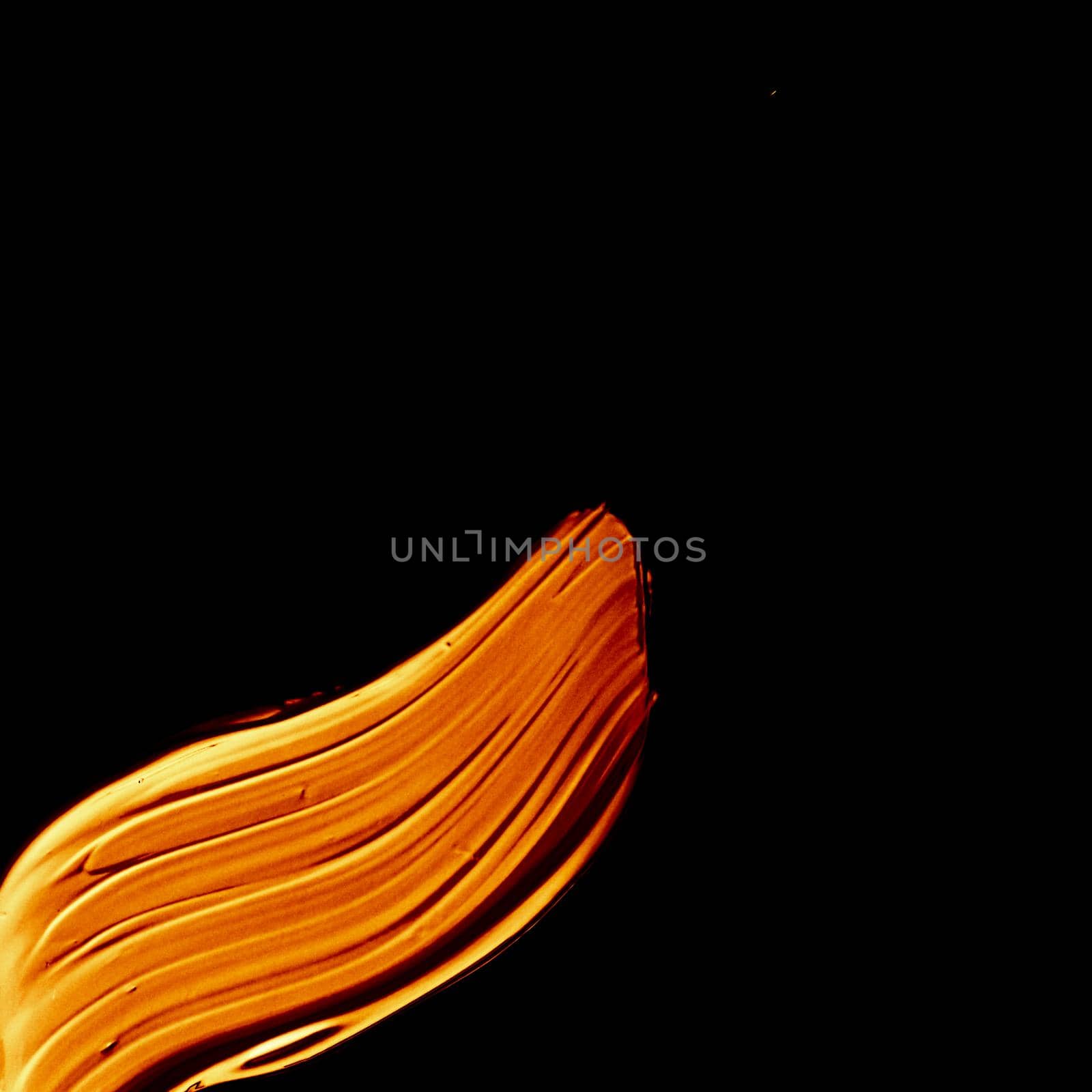 Art abstract, cosmetic product and hand painted design concept - Golden paint brush stroke texture isolated on black background