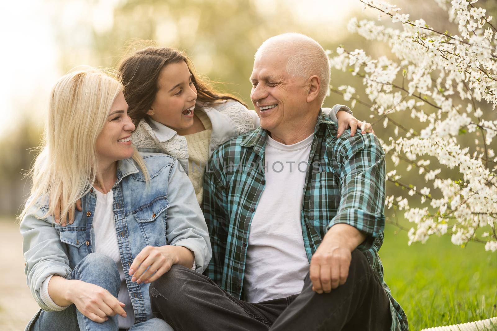 Generation Family On Grass Together in the garden.