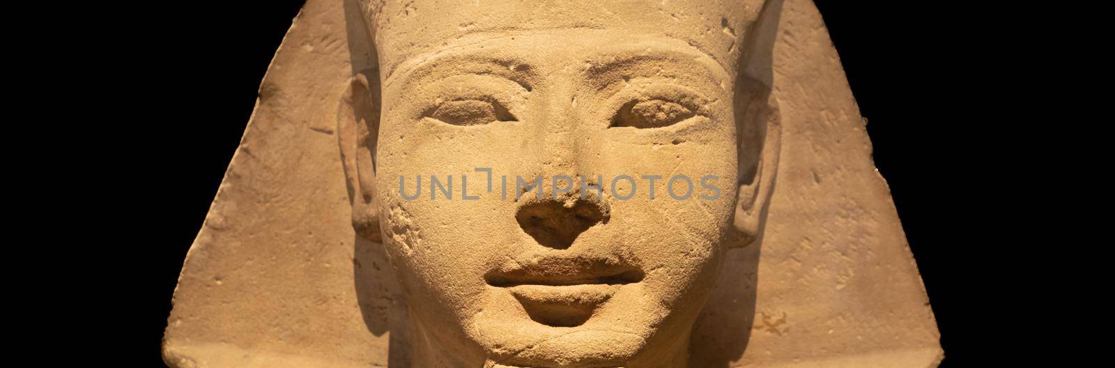 Egyptian archaeology. Ancient Sphinx in sandstone representing the pharaoh, copy space. by Perseomedusa