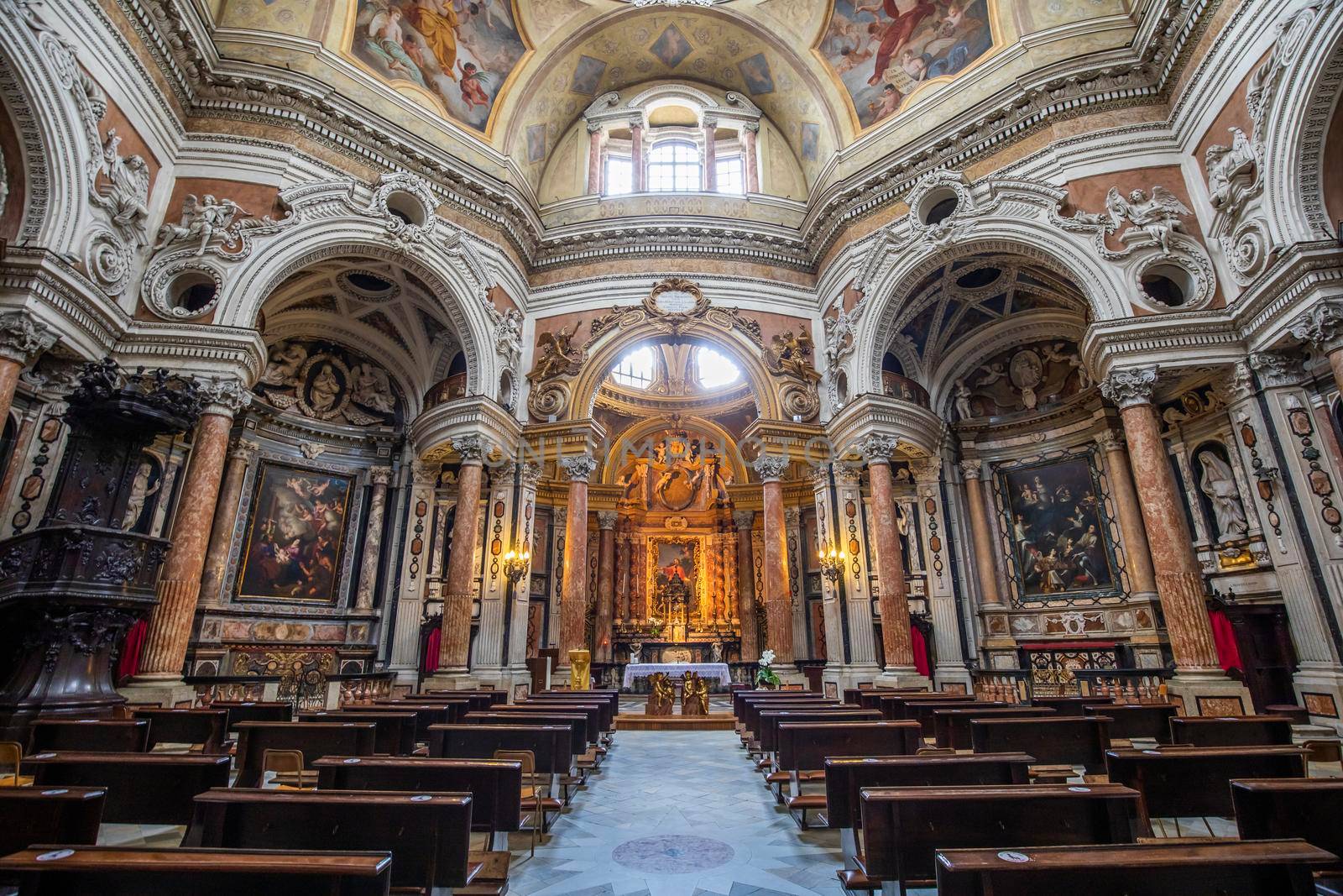 TURIN, ITALY - CIRCA MAY 2021: Antique baroque interior with vintage decoration. Royal Church of San Lorenzo (St. Lawrence).