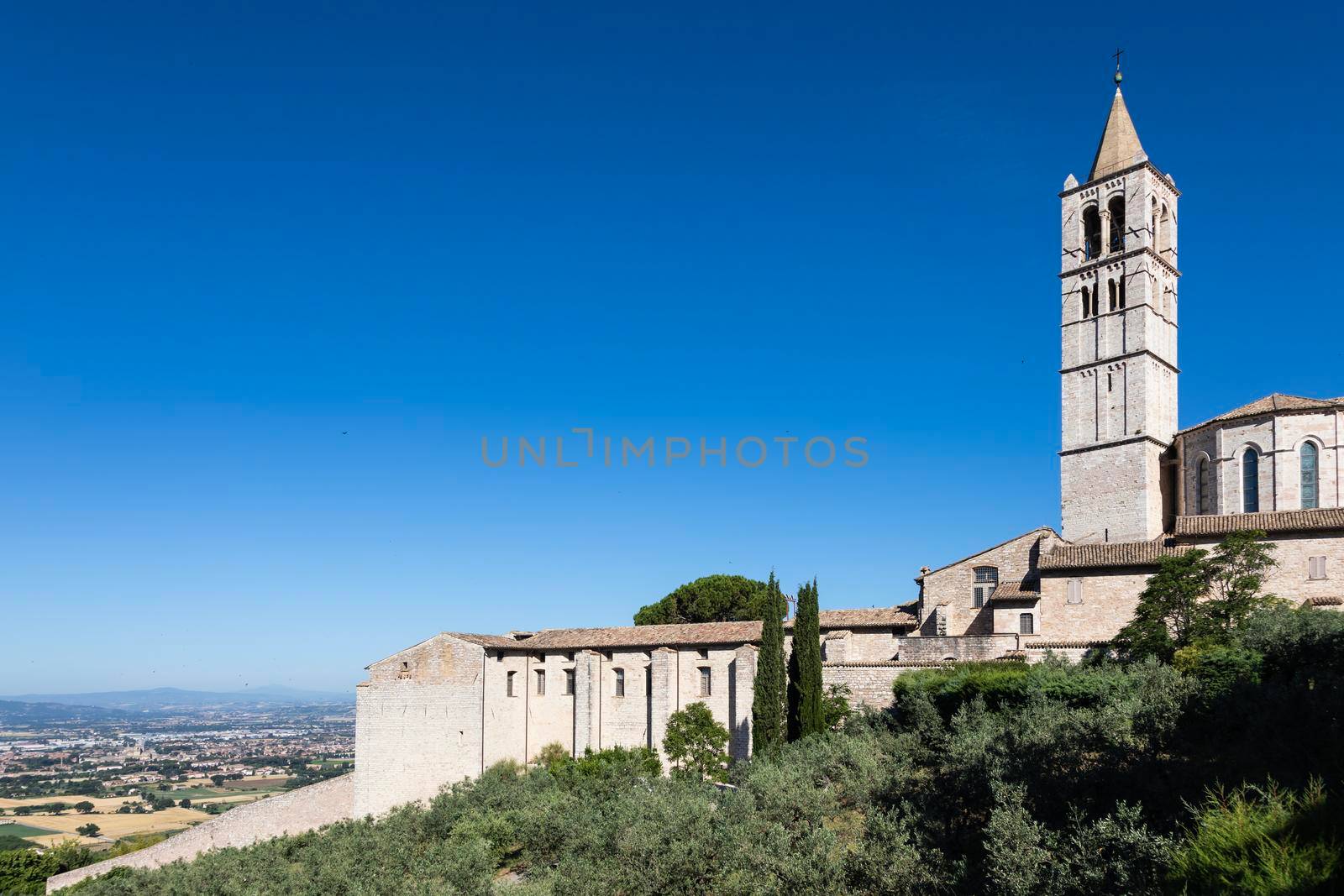 Church in Assisi village in Umbria region, Italy. The town is famous for the most important Italian St. Francis Basilica (Basilica di San Francesco)