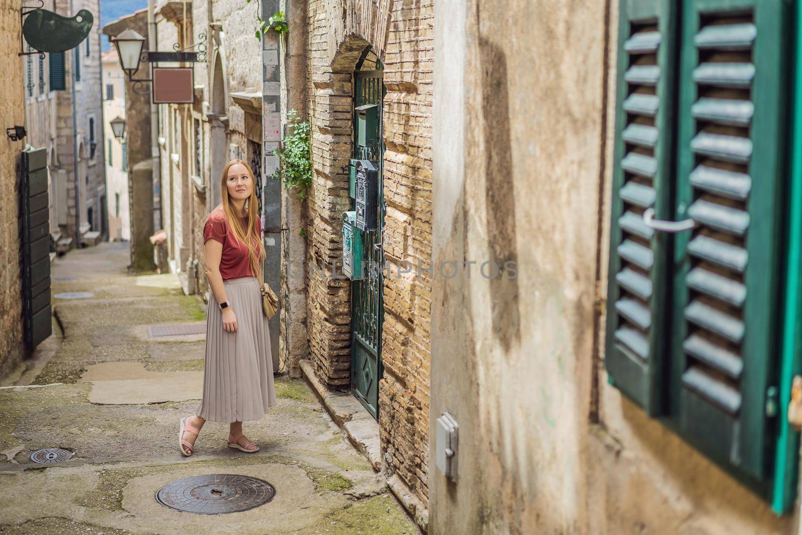 Woman tourist in Herceg Novi old town. Historical and touristic center of Herceg Novi. Montenegro.