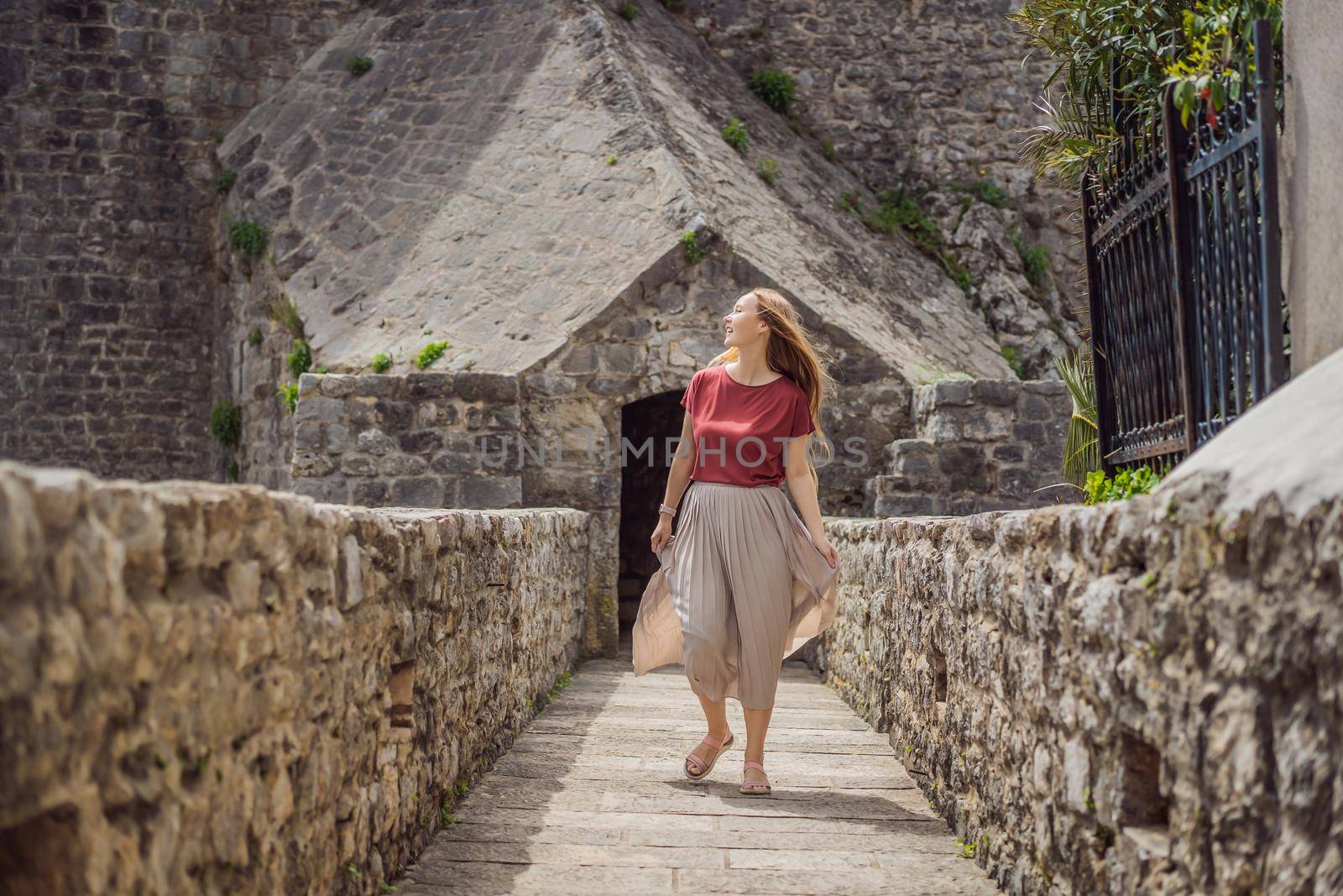 Woman tourist in Herceg Novi old town. Historical and touristic center of Herceg Novi. Montenegro.