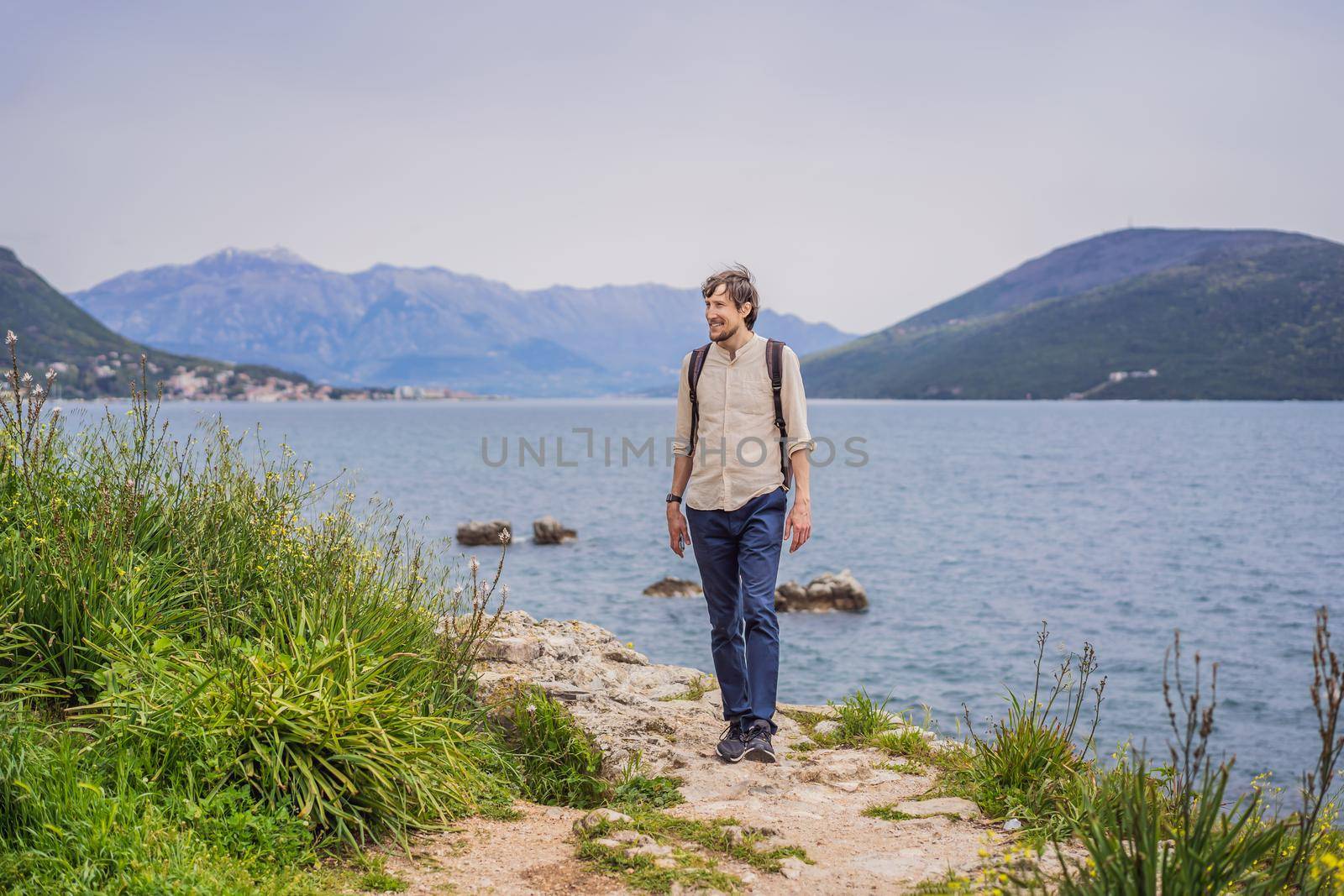 Man tourist in Herceg Novi old town. Historical and touristic center of Herceg Novi. Montenegro.