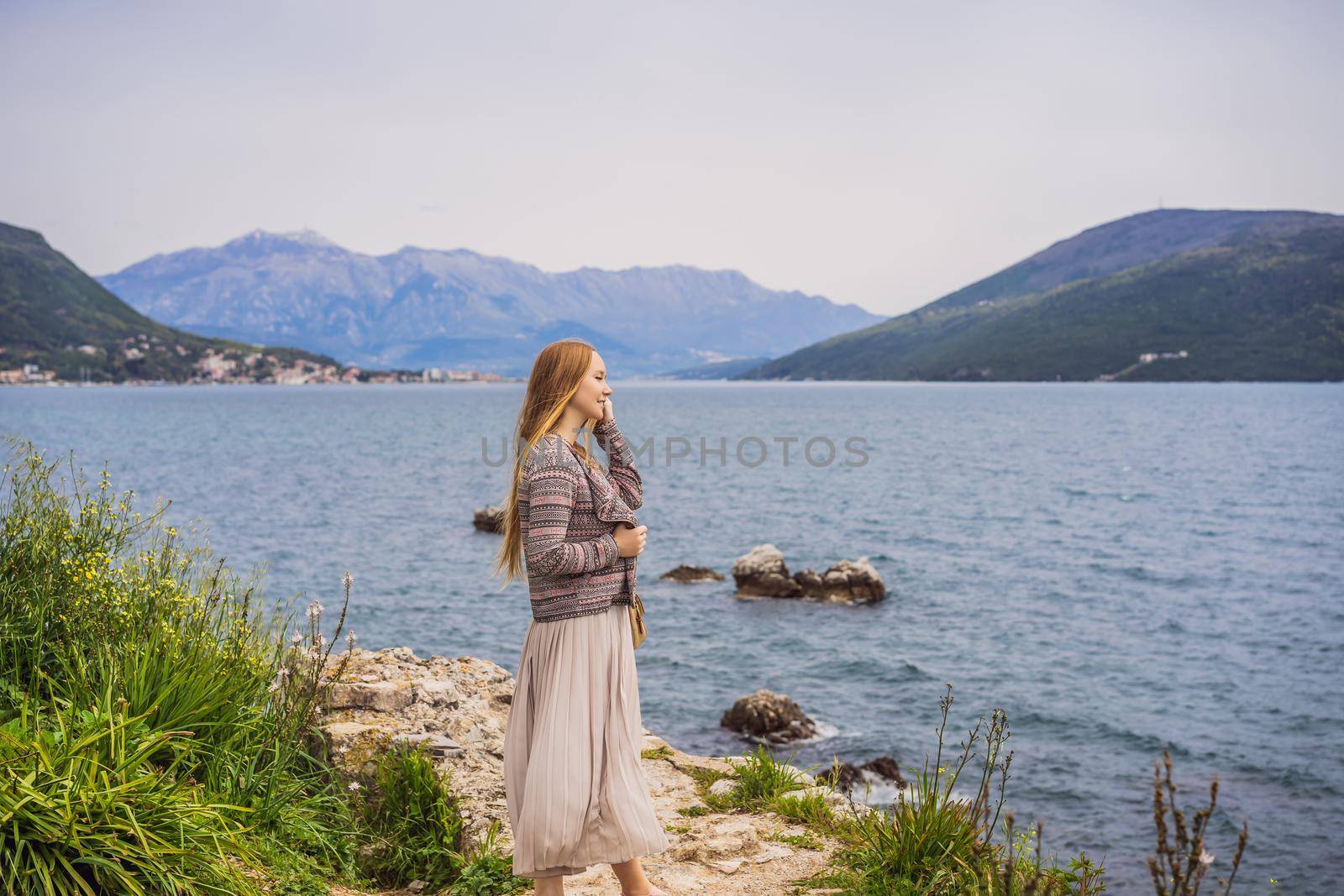 Woman tourist in Herceg Novi old town. Historical and touristic center of Herceg Novi. Montenegro.