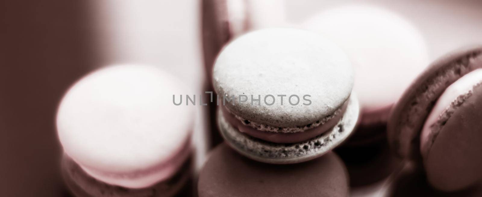 French macaroons on milk chocolate background, parisian chic cafe dessert, sweet food and cake macaron for luxury confectionery brand, holiday backdrop design by Anneleven